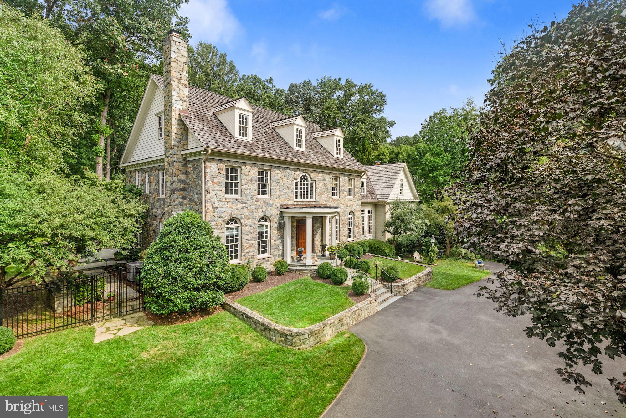 JUST LISTED! HANDSOME AND TASTEFUL STONE AND BRICK GEORGIAN STYLE HOME ON 2 ACRES WITH FULL HOUSE GENERATOR, UNDERGROUND SPRINKLER SYSTEM, FENCED REAR GARDEN, TERRACE WITH FIREPLACE, EMBASSY SIZED LIVING ROOM, LIBRARY AND OFFICE, 5 BEDROOMS, 5 FULL + 2 HALF BATHROOMS, 2 CAR GARAGE WITH ROOM FOR 3RD CAR, KITCHEN WITH ALL STAINLESS APPLIANCES, WALK-OUT LOWER LEVEL, RECREATION ROOM, WORKOUT ROOM, CRAFT ROOM ETC.  A MUST SEE FOR GRACIOUS LIVING - AND MINUTES TO DC, TYSONS AND ALL POINTS IN MARYLAND.