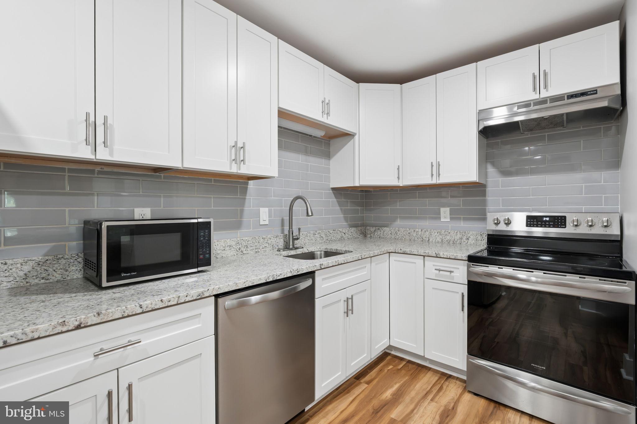 Welcome to this beautifully renovated 2-bedroom, 2-bathroom top-floor condominium in the highly sought-after Silver Ridge community! This move-in-ready home has been thoughtfully updated with stylish finishes throughout, including new luxury flooring, elegant 6-inch baseboards, and fresh neutral paint. The completely remodeled kitchen features modern cabinetry, countertops, and fixtures, while the spacious primary suite boasts a fully renovated en-suite bathroom. Enjoy the privacy and tranquility of a third-floor location, where you can enjoy your morning coffee on a balcony. Additional peace of mind comes with a new condominium roof installed in 2022. Conveniently located just seconds from Belair Road, this home offers quick access to shopping, dining, and major commuter routes while still providing a quiet place to call home. Don't miss your opportunity to own this turnkey gem in Silver Ridge!
