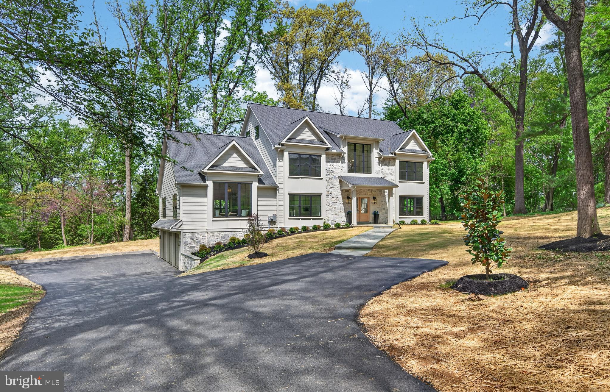 This custom home by Rudloff Custom Builders, showcases timeless design and exceptional craftsmanship throughout.  The home seamlessly blends architectural elegance with modern luxury, expansive living spaces —creating a rare opportunity to enjoy both privacy and convenience in one of the region’s most desirable locations.

Step inside to a thoughtfully designed open floor plan highlighted by a welcoming two story foyer with custom herringbone flooring. The stunning great room, featuring a floor-to-ceiling stone fireplace and a vaulted, beamed ceiling offers plenty of space to entertain or to enjoy the gorgeous views from the large windows.  The equally impressive kitchen anchored by a large 10 foot center island, is complemented by high-end Thermador appliances and abundant 48” cabinetry for optimal storage. The stone backsplash and custom vent hood add just the right touch. There is a walk-in pantry, and access to the mud room with its porcelain checkboard flooring, built-in cabinetry and seating. There is an open stairway for easy access to the garage and first floor laundry room.  The first-floor office showcases the custom millwork the builder is known for, adding warmth and character throughout. There is a formal dining room adjacent to the kitchen and is perfect for large dinners.

On the second floor, the spacious primary suite offers hardwood floors, dual walk-in closets with custom organizers, and a luxurious en suite bath with a large walk-in shower. Three additional generously sized bedrooms include one with a private bath and two sharing a Jack-and-Jill suite.

The property also includes a large, versatile third-floor retreat, perfect for a media room, hosting movie nights or just as a private retreat for rest and relaxation.  There is fully finished basement with engineered hardwood flooring and inside garage access.

This residence offers a rare opportunity to enjoy privacy and convenience in one of the region’s most desirable locations.