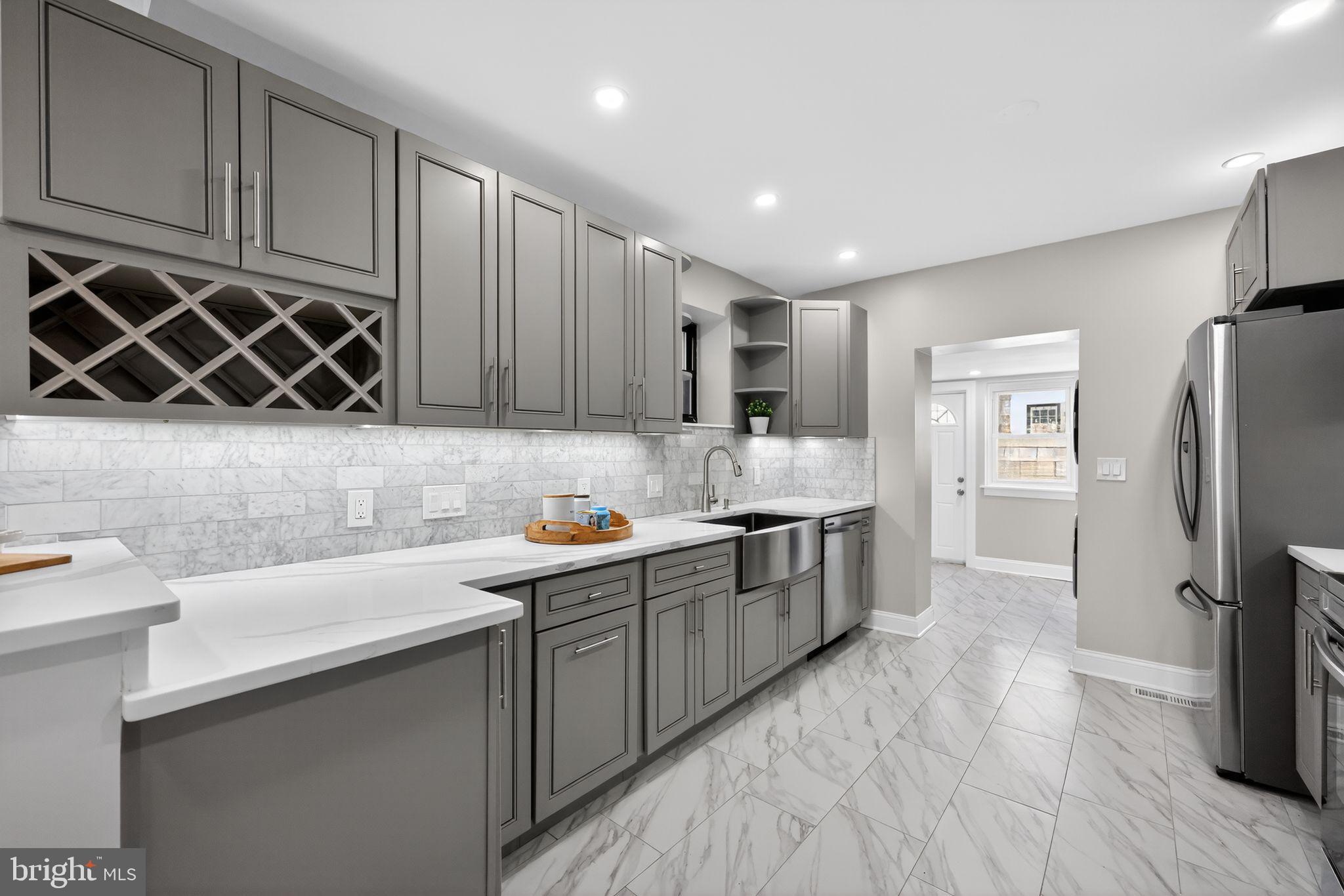 2303 Saint Albans Street is a fully renovated 5-bedroom, 3.5-bath Victorian-era rowhome with over 2,500 square feet  plus a finished lower level, set behind a classic brick facade with mansard roof and dormer windows on one of Graduate Hospital's rare car-free garden blocks.

Every system in this home is new. The kitchen, all bathrooms, electrical, plumbing, mechanicals, and windows have been completely renovated so Its move-in-ready. The main level opens to bright living and dining rooms with tall windows, wainscoting, and hardwood floors leading into a galley style kitchen finished with quartz counters, marble-tile backsplash, custom cabinetry, and stainless steel appliances including a farmhouse sink. A rear laundry room and powder bath complete this floor, which walks out to a private back patio. Upstairs, the second floor holds three well-proportioned bedrooms and a fully renovated full bath, while the third floor is anchored by a primary suite spanning nearly 15 by 22 feet with a spa-style en-suite bath and generous closet space. Just steps from the suite, a fifth bedroom on this floor offers flexible bonus space, ideal as a nursery, home office, yoga or meditation room, or dedicated Peloton studio. A finished lower level adds nearly 400 additional square feet of space for a home office, gym, media room, or guest suite, plus a 3rd full bath.

Outside, St. Albans is one of Philadelphia's few true pedestrian garden blocks: no cars, just a shared landscaped courtyard and brick walkways. It's also the block where "The Sixth Sense" filmed its most memorable scene, a fun bit of Hollywood history layered onto an otherwise peaceful residential enclave.
The location delivers everyday Graduate Hospital living at its best. Grab coffee or brunch at neighborhood staples like Sabrina's Café or Ants Pants Cafe, stock up on groceries at Heirloom Market or South Street Market, and book dinner at nearby kitchens like Illata or Pine Street Grill. Spend weekends along the Schuylkill Banks Boardwalk, Julian Abele Park, or Grays Ferry Triangle, and cross the South Street Bridge for a commute of about 10-15 minutes to Penn, Drexel, CHOP, HUP, and Penn Presbyterian, making this an especially convenient home base for medical and higher-education professionals. Rittenhouse Square and Center City are minutes away on foot, by bike, or via the SEPTA bus routes.

Anyone seeking a walkable, low-maintenance lifestyle in one of Philadelphia's most connected and charming neighborhoods will feel right at home at 2303 Saint Albans Street. Schedule your tour today.