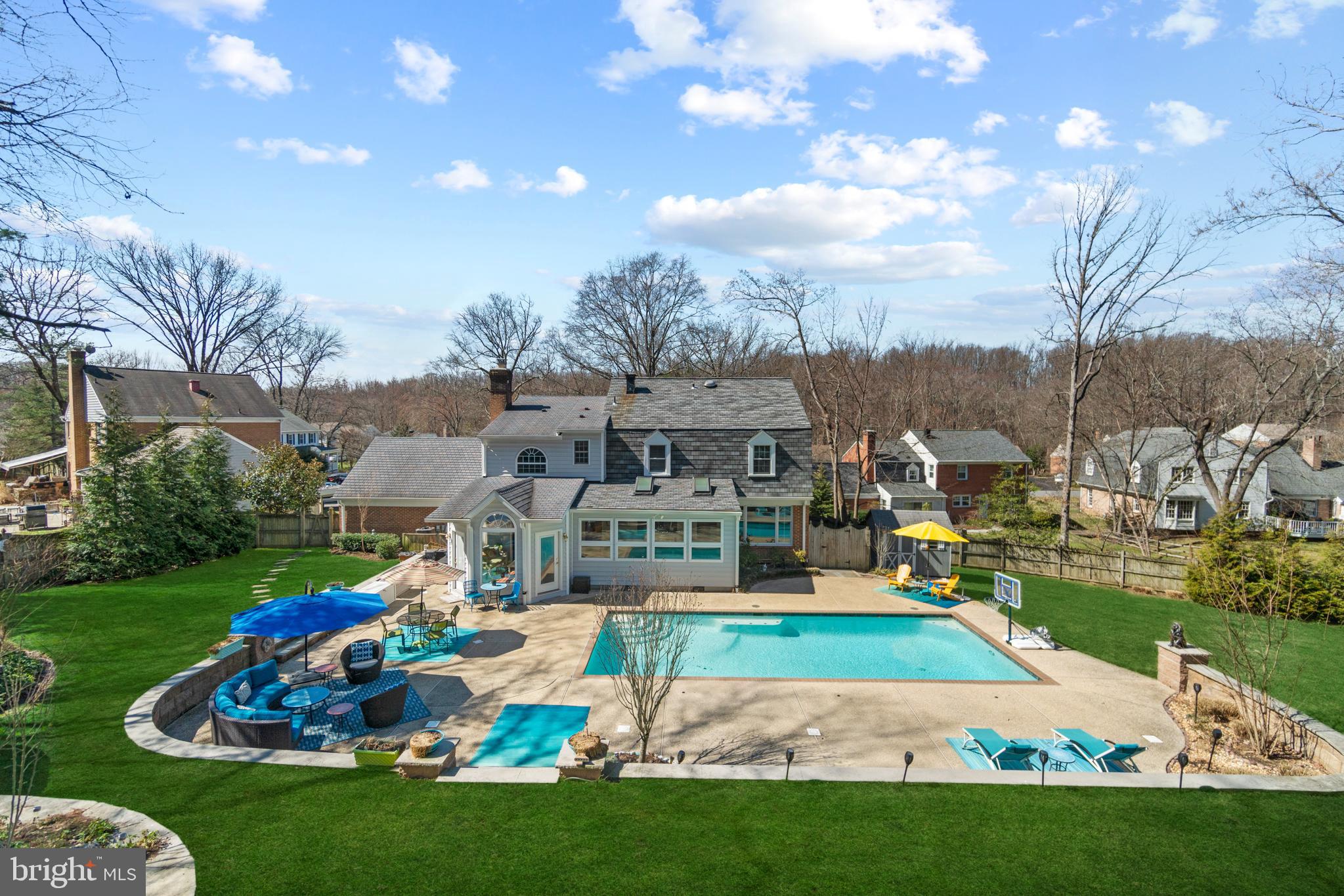 OFFER DEADLINE- Tuesday, March 22nd at 5  PM. Your summer oasis awaits! Dreaming of warmer weather to relax poolside or how about more space to entertain for those summer parties/bbq's? Then look no further and call this home. This 4 BR/3FB/2HB colonial perched on a 1/2 acre and walking distance to Potomac Village, is the quintessential summer retreat but in the comfort of your own home. The outside shouts 'Honey stop the car!' from the long driveway to the fully fenced rear yard that features a saltwater pool, multiple seating areas, TONS of yard space, extensive and impressive hardscape, a grilling area and shed to house pool accessories and gardening equipment. Inside is just as impressive as the exterior. The main level boasts an office, oversized dining room, sitting room off kitchen with bar, a spacious and updated kitchen, a breakfast room with pool views and skylights, a sun room off the breakfast room with access to the backyard, a living room with a wood burning fireplace, laundry/mud room and half bath. Moving upstairs, the primary bedroom is setback which enhance your retreat experience. Primary bedroom features hardwood floors, a spacious primary bathroom and what use to be the 5th bedroom was converted into a large closet (someone could convert this back if desired). Finishing the upstairs are 3 bedrooms and 2 full bathrooms.  Still looking for more space? How about a recreation room with a wet bar, movie theater area (movie theater equipment & sets convey with sale of property), space for your workout equipment, another half bath and ample storage space.