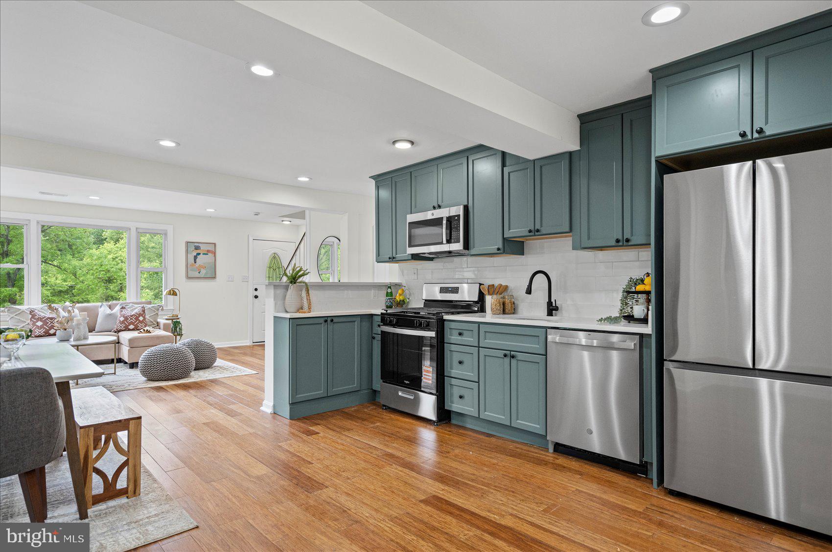 Adorable and newly renovated 4BR/1.5BA expanded Cape located on a lush green lot in the quiet neighborhood of Silver Creek.  Make your way to the front door and step inside a home filled with natural light, a neutral color palette, luxury wide plank flooring, recessed lighting, and an open concept main floor plan.  The main living area offers a spacious living room open to the dining room and gorgeous kitchen, and a laundry closet.  The kitchen features abundant cabinets finished with crown moldings, stainless steel appliances, sleek quartz countertops with a subway tiled backsplash, and a deep stainless sink. The main floor also offers two sizable bedrooms and a newly remodeled full bathroom.  The second floor features two large bedrooms, a half bath and hidden storage.  From the main floor step through sliding doors onto a large wood deck that overlooks a yard filled with green space, adult trees and numerous possibilities. This move-in-ready home is ideal for any new homeowner and is located near shopping, restaurants, and commuter routes.