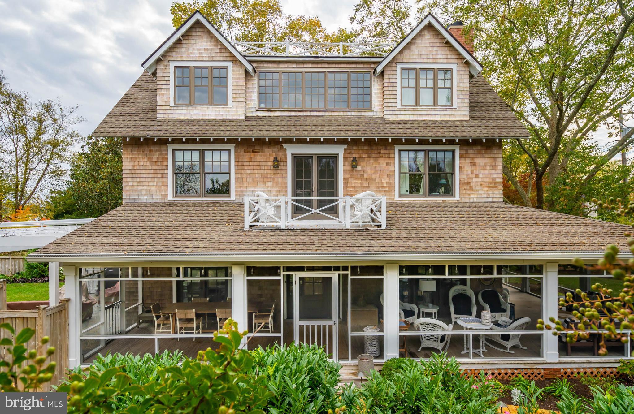 Amazing opportunity to own the ultimate  property for entertaining and privacy close to town.  This home is nestled in a small cove next to Silver Lake.  Entering the expansive screened porch you are welcomed by opportunities for dining, relaxing and entertaining.  As you enter the home, you face one of the best features, a four floor elevator.  
Life at the beach is supposed to be simple and the elevator allows you effortless access to upper and lower floors. The huge living room can accommodate all your guests and the wood-burning fireplace adds a comfy feel no matter the season.  On the other side of the house you experience the warmth of the kitchen and dining area.  The attention to detail is obvious from the moment you enter.  The wolf stove is a stand out and all other appliances are of the highest quality.  The adjacent pantry and bar area allow you to entertain with ease.  Taking the stairs to the second floor you approach three spacious bedrooms and two baths, one with laundry room.  There is a porch on this floor for morning coffee or evening drinks with views of the lake.  The third floor master bedroom suite includes a full living area with fireplace, a work area, an additional sitting area with views of the lake and the bedroom with ample closet space.  The large master bathroom has marble tile throughout,  and also includes a laundry.  There is a wet bar on this level
so that you can prepare your drinks for the roof top deck.  Expansive views of Rehoboth greet you and this spacious deck makes and excellent choice for entertaining.  
The lower floor of the house is a great place for watching TV, or play pinball in the game room.  There are two sets of bunk beds and plenty of storage space next to the walk out staircase. 
The paved patio area makes for even more entertaining space and is complimented by the heated pool and landscaped yard.  
This is truly a must see property for those who value their privacy, want to be close to town and love to entertain!  
There is even a public walking bridge  nearby for your short stroll into town.