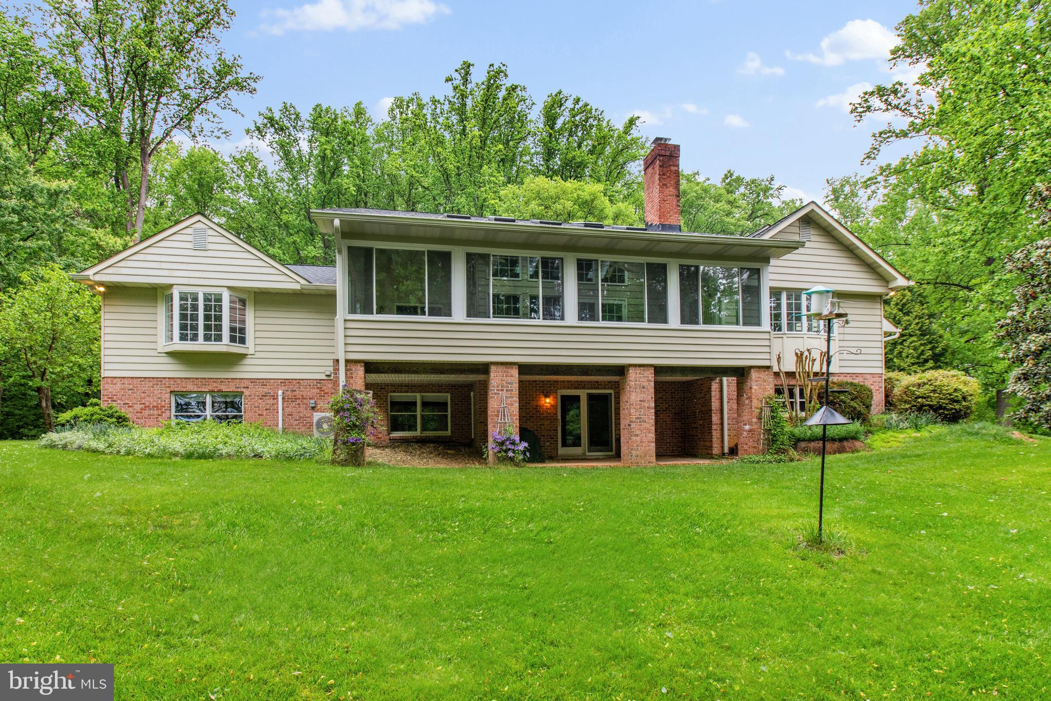 Custom built home in a private and unique setting surrounded by mature trees, this charming brick-front home offers space, character, and peaceful surroundings while still being conveniently located. Two car side load garage with ample parking for guests. The main level offers a well-designed layout including a welcoming foyer, a spacious living room, dining rm ,two story family room with a fireplace, opens to a sunroom —perfect for relaxing evenings and entertaining. The kitchen is situated for those who like to cook and enjoy nature at the same time.

The main-level primary suite, complete with a dressing room, walk-in closet, and private bath, offering convenience and privacy.

Upstairs, you will find two additional bedrooms and a full bath, providing comfortable accommodations for family or guests and a storage room. 

Discover the ultimate footprint for entertainment and relaxation with a fully finished walkout basement. The recreation room creates an inviting atmosphere for movie nights or a secondary lounge. Adjacent to rec room, the dedicated game room comes ready for play, featuring a pool table set beneath a classic billiard-style pendant, casting the perfect glow for your next tournament. A generous fourth bedroom outfitted with stylish wood-look vinyl plank flooring for a modern, durable finish. This private retreat includes an attached den, offering the perfect setup for a quiet library, guest quarters, or a secluded home office. A full bath ensures comfort and convenience for guests and residents alike. Seamless indoor-outdoor living is achieved through the walkout access, leading you to a covered paver patio overlooking the private wooded lot.

Enjoy the privacy of 6+ acres which includes an additional parcel just shy of 1 acre conveyed with the main parcel.

PROFESSIONAL PHOTOS COMING SOON!

Roof: +/- 5 years; 3 zones heat pumps: zone 1=primary bedroom (2019), zone 2=main level (2019), zone 3=upper level (2008); ductless systems in basement (x2): 2026. Water heater: 2009. Verizon broadband/fiber optic is available.
