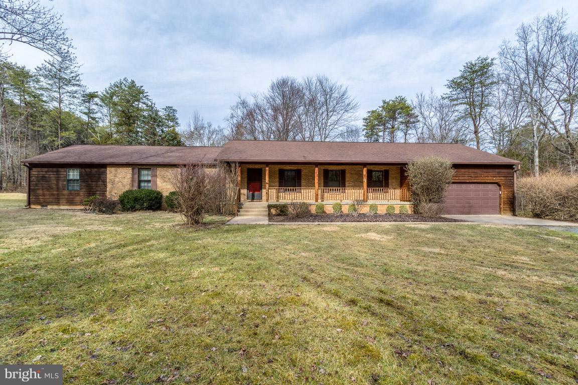 MOTIVATED SELLER! Bring all reasonable offers! Gorgeous 5 bedroom 3 bath rambler sitting on 10 acres! Beautiful Tobacco Road hardwood floors inside this spacious floor plan. Large country kitchen with stainless steel appliances opening to the breakfast nook and family room with separate dining room and a formal living room. Enjoy your evenings on the covered front porch or deck!