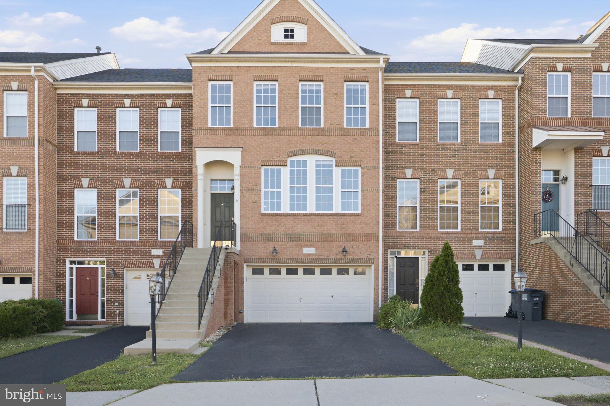 Welcome to 42040 Angel Arch Terrace, a beautifully maintained brick-front townhome in the highly sought,  Stone Ridge community of Aldie. 
Offering over 2,500 square feet of thoughtfully designed living space, this exceptional home features three finished levels with spacious bump-outs on every floor, creating an open and inviting layout perfect for modern living.
The main level showcases gleaming hardwood floors and a gourmet kitchen complete with granite countertops, stylish backsplash, ample cabinetry, and a functional layout ideal for both everyday living and entertaining. Step outside onto the private deck and enjoy peaceful views overlooking open green space and grassy fields.
Upstairs, you'll find generously sized bedrooms and comfortable living areas, while the fully finished lower level offers a valuable fourth bedroom, providing flexibility for guests, a home office, or multi-generational living.
Additional highlights include a spacious two-car garage, abundant natural light throughout, and a floor plan designed to maximize both comfort and functionality.
Located within the award-winning Stone Ridge community, residents enjoy exceptional amenities, beautiful walking trails, pools, playgrounds, fitness facilities, and a vibrant neighborhood atmosphere. Conveniently situated near shopping, dining, commuter routes, and top-rated schools, this home offers the perfect blend of comfort, convenience, and community.

Don't miss this incredible opportunity to own a stunning townhome in one of Aldie's most desirable neighborhoods!