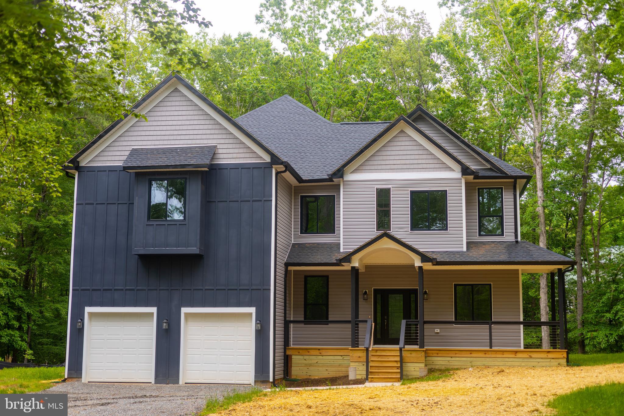 Experience brand-new construction at Lake Anna with deeded lake access, boat ramp access, and your own boat slip (Morgan II, Pier 2, Slip 7).  The open-concept layout, soaring ceilings, and expansive windows create a bright, airy living space with serene wooded views. Meticulously designed, this home showcases premium finishes, elevated craftsmanship, and modern lake-style living. 

The modern kitchen is equipped with all-new appliances, quality finishes, and a large center island designed for everyday living and effortless entertaining. Upstairs, the primary suite offers a spacious private retreat with an en-suite bath, dual walk-in closets, and an adjoining flex room ideal for a nursery, office, or sitting area. Two additional bedrooms are connected by a Jack-and-Jill bath, creating a functional layout for family or guests.

The main level adds even more flexibility with an additional bedroom, full bath, and dedicated office or study—ideal for guests, remote work, or multi-generational living. Thoughtfully designed with space, comfort, and function in mind, this home delivers the best of new construction and life at Lake Anna. Long lake days. Sunset boat rides. Brand-new construction without the wait. Ready for summer.