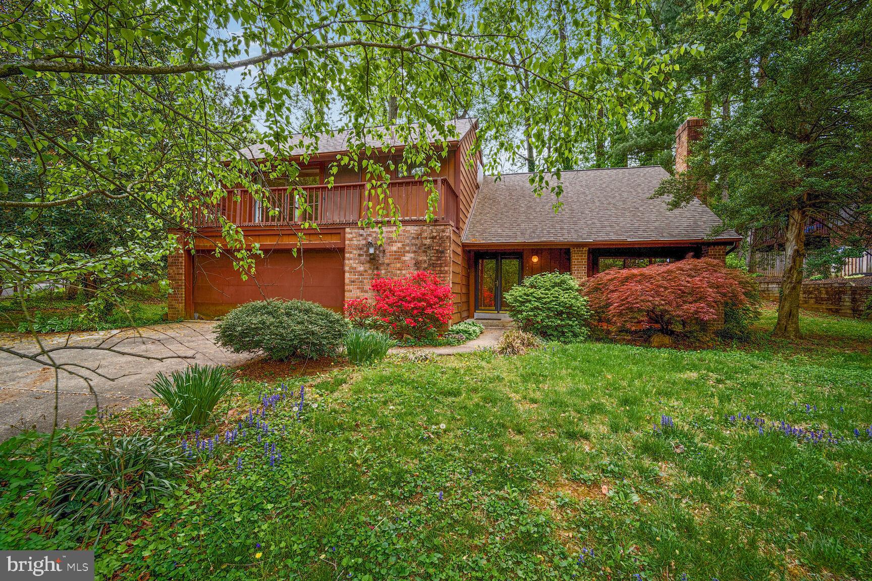 Welcome to 6400 Recreation Ln. in Falls Church, a custom-built contemporary home located on a quiet cul-de-sac in the desirable Lake Barcroft Cloisters! This spacious residence features four bedrooms and three full bathrooms, offering the perfect canvas for your personal updates and design vision. ** Step into a welcoming foyer with hardwood floors that lead into a sunken living room with a cozy wood-burning fireplace surrounded by classic brickwork. Just above, the formal dining room with hardwood floors overlooks the living space and connects directly to the eat-in kitchen, which boasts granite countertops, stainless steel appliances, 12x12 ceramic tile flooring, a pantry, recessed lighting, and sliding glass doors that open onto a generous back deck. The expansive deck, with stairs leading to a beautifully landscaped backyard oasis, is perfect for outdoor living and entertaining. **
Upstairs, the primary bedroom retreat features a vaulted ceiling, private balcony, two closets, and an en suite bathroom. Three additional spacious bedrooms share a full bath on the upper level. ** The lower level offers a warm and inviting family room with recessed lighting, a second wood-burning fireplace with a brick surround, and a wet bar—ideal for relaxing or entertaining. A versatile bonus room can serve as a guest bedroom, home office, or fitness space and includes a walk-in closet. A full bath with a shower completes the lower level. ** Additional highlights include a 200-amp electrical panel updated in 2013, a new hot water heater installed in 2015, and a heat pump from 2007. ** The property also features a two-car garage with automatic opener and a multi-car driveway, providing ample parking. This stylish contemporary home is just waiting for your finishing touches to make it truly yours.