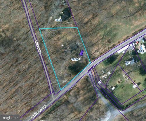 Investor Alert! Location, Location, Location!! Seller has gutter the home so you can start with a clean slate to  let your imagination go wild!! There is a large detached garage in need of repair. Seller had Young Septic inspect septic and gave quote to replace septic tank in which seller will do with a good offer. Please call listing agent to see property if unrepresented.