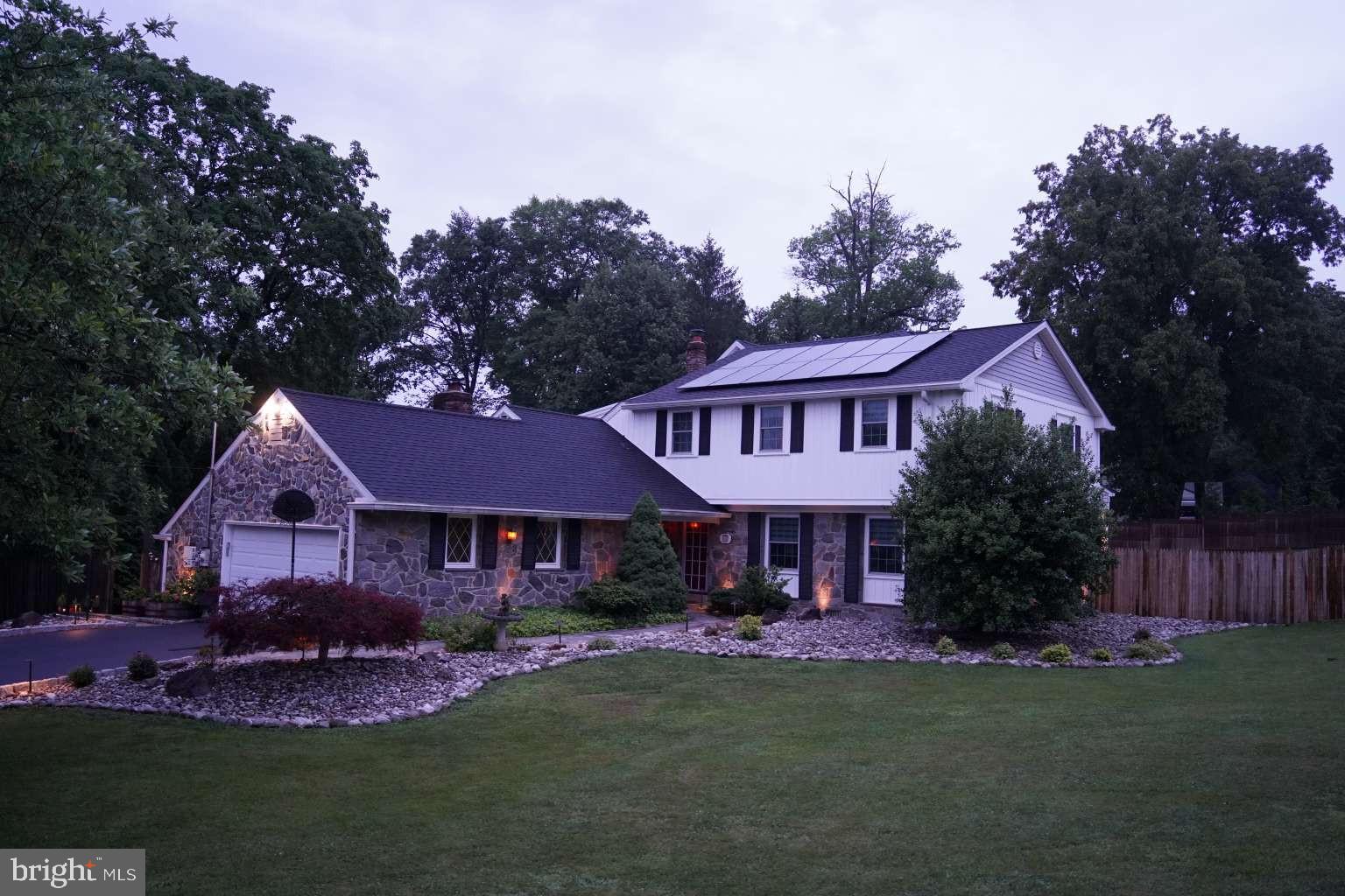 Some homes are renovated. Others are transformed. Over four major renovation phases spanning 2016 through 2026, this exceptional residence has been thoughtfully reimagined, expanded, modernized, and upgraded into a one-of-a-kind Main Line estate where luxury living, modern infrastructure, energy efficiency, and future outdoor potential come together seamlessly. Situated on a quiet three-quarter-acre corner lot within the award-winning Tredyffrin-Easttown School District, this impressive residence offers approximately 4,900 square feet of above-grade living space, 8 bedrooms, 5 full bathrooms, and a level of planning and investment rarely found in today's market. A newly constructed driveway accented with elegant Belgian block curbing welcomes you home, while mature landscaping, professional landscape lighting, and expansive grounds create an inviting setting. The highly usable lot provides abundant space for outdoor living, recreation, gardening, entertaining, and future enhancements. Inside, the home is flooded with natural light through an abundance of windows, skylights, and sun tunnels. The open-concept floor plan was designed for modern living and effortless entertaining, anchored by a chef's kitchen featuring premium GE Monogram appliances and generous gathering spaces that naturally become the heart of the home. A rare and highly desirable feature is the presence of two independent primary suites, each offering a private bathroom and expansive walk-in closet space. The finished walkout lower level adds approximately 800 square feet of additional living space and includes an additional bedroom and full bathroom, making it ideal for guests, recreation, fitness, a home office, or extended family living. Beyond the visible beauty lies one of the property's greatest strengths: its extensive infrastructure upgrades. The home is served by three recently upgraded HVAC systems, a boiler-based heating system, two independent hot water heater systems, and professionally integrated solar panels that provide exceptional energy efficiency while preserving the home's aesthetic appeal. Modern convenience and security have been carefully integrated throughout with a professionally installed security system, exterior CCTV camera network, and smart-home lighting controls utilizing Wi-Fi-enabled switches. The home currently features a gas fireplace, a traditional wood-burning fireplace, and an electric fireplace, while gas infrastructure has already been installed to support up to two additional future fireplaces. Perhaps most remarkable is the extensive site-development work that has already been completed. A comprehensive stormwater management system was professionally engineered, approved, constructed, surveyed, completed, and formally recorded as part of a long-term master plan for the property. The approved plan was specifically designed to accommodate a future 35' x 22' custom swimming pool and integrated spa, allowing a future owner to benefit from years of engineering, permitting, construction, and regulatory work that has already been completed. Adding further peace of mind, the home features new roofs, new windows, and new siding, reflecting the comprehensive nature of the renovation effort and reinforcing the property's move-in-ready condition. This is far more than a renovated home. It is the result of a decade-long commitment to thoughtful improvement, quality craftsmanship, infrastructure investment, and long-term vision. Opportunities to acquire a property of this caliber are exceptionally rare.