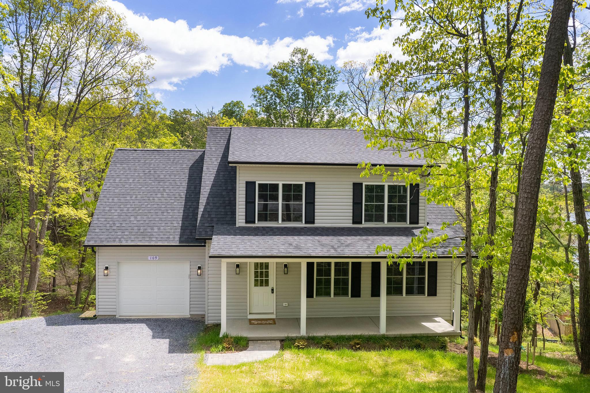 Low-maintenance new construction—no updates needed! Perfect for weekend lake living or simply downsizing to one level! Welcome to Lake Holiday living—where everyday life feels like a getaway.
This brand-new 3-bedroom, 2-bath Cape Cod is perfectly situated on a quiet cul-de-sac in the gated Lake Holiday community, offering the rare opportunity to own new construction without the wait. Designed for both comfort and convenience, the home features a sought-after main-level primary suite with a walk-in closet, dual vanities, and a beautifully tiled walk-in shower. The open-concept main living area is filled with natural light and connects seamlessly to a well-appointed kitchen with granite countertops, shaker-style cabinetry, stainless steel appliances, and a center island—ideal for everyday living or entertaining. Upstairs, you’ll find two generously sized bedrooms and a full bath, providing flexible space for guests, family, or a home office. Enjoy your morning coffee or unwind in the evenings on the 26-foot covered front porch, taking in the peaceful, wooded surroundings. The full walkout basement with rough-in plumbing offers 800+ square feet of future living space—ready to finish to suit your needs. Located just 15 minutes from Winchester, Lake Holiday offers an unmatched lifestyle with private lake access, beaches, boat docks, clubhouse, fitness center, tennis courts, and more—all within a secure, gated community. If you’ve been considering new construction, this is your chance to skip the build time and move right in. Check out our 3-D tour and Lake Holiday video attached to this listing! Builder will add deck with acceptable offer. Builder warranty included.