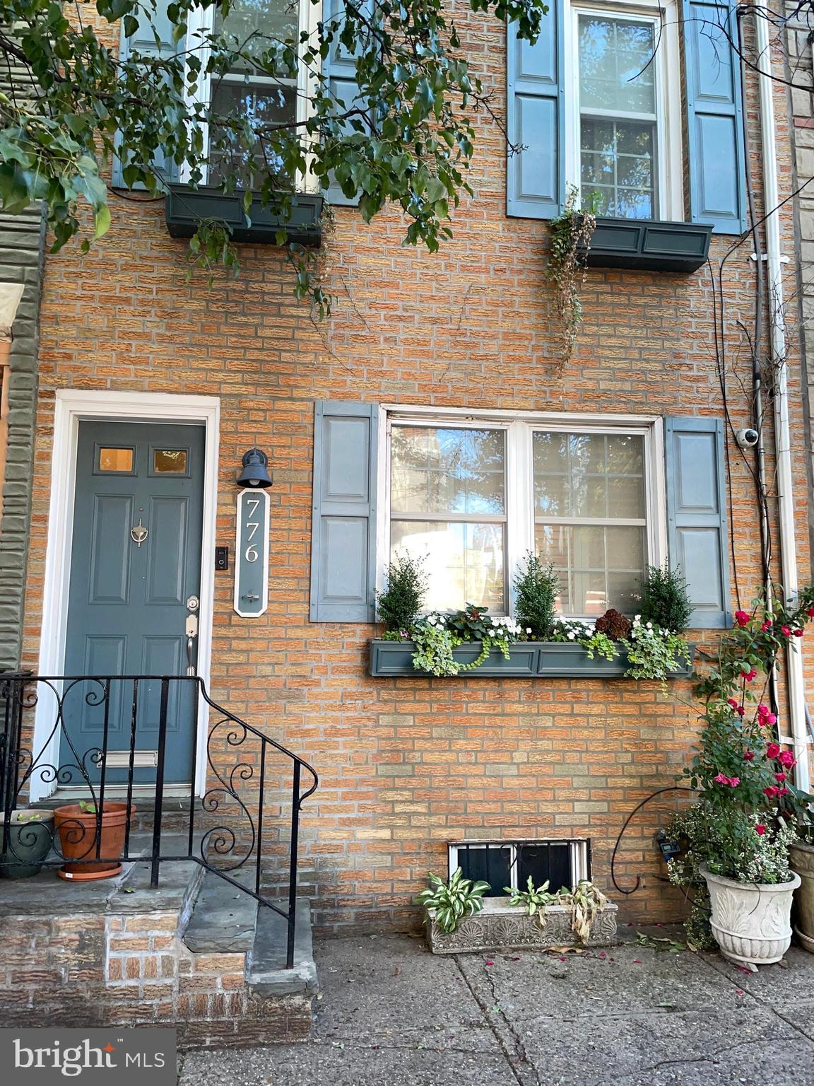 Welcome to 776 Martin Street, set along the historic Marian Anderson Way in the heart of Graduate Hospital. This rare location offers parking on both sides of the street while also providing full rear property access from Harshaw Street. This access allows for potential off‑street parking and convenience for such things as loading/unloading and taking out trash.

Enter to find a bright, open first floor. The living room, accented with interior shutters, transitions seamlessly into the dining space and the modern kitchen complete with bar seating.
The second floor features a full bath and two well‑appointed bedrooms, each offering hardwood floors, generous closet space, and plenty of natural light.

Ascend to the beautiful third‑floor addition, a flexible retreat complete with a full bath and a dry bar with mini‑fridge. This bright space opens directly to the roof deck, creating an effortless indoor‑outdoor flow. The deck offers private outdoor living with sweeping skyline views.

Its prime location grants easy access to South St, Broad St, Kimmel Center, Academy of Music, theaters, public transportation (to/from sports complexes) and major roadways. It’s within walking distance to Rittenhouse Square and local favorites such as, Loco Pez, Pub and Kitchen, The Side Car, Doc Street, Sabrinas Cafe, Parc, Dandelion, Friday Saturday Sunday, and more.

This home is city living at its best!