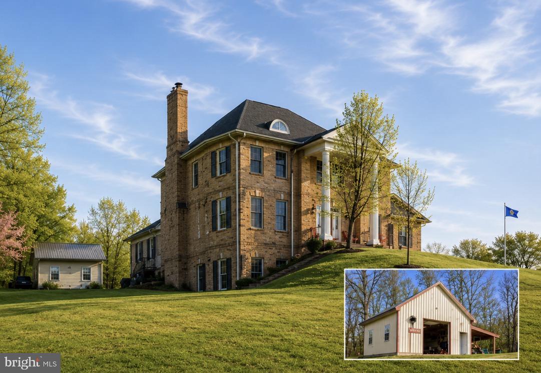 Stately all-brick colonial set on a private, elevated site with spectacular mountain views and million-dollar vistas stretching for miles. Surrounded by scenic countryside and positioned to capture breathtaking panoramic views of the surrounding mountains, this impressive residence sits on over three wooded acres in sought-after Boonsboro, offering exceptional privacy, timeless construction, and an unforgettable natural setting.

The home features a grand colonial layout with expansive, light-filled living spaces designed for both everyday living and entertaining, including a large eat-in kitchen ideal for gatherings and daily living. Two interior staircases add both character and convenience throughout the home. The designer primary bath has been completely remodeled with custom appointments, featuring heated floors, a clawfoot soaking tub, towel warmer, and a spacious walk-in shower. A laundry area on the main level with washer and dryer adds everyday practicality.

A finished walk-out lower level includes one bedroom and a full bathroom, providing flexible space for guests, recreation, or extended living.

Recent improvements and features include updated sensor lighting throughout the home, a water treatment system, stainless bath finishes, and clothing rod stops in closets.

Outdoor amenities enhance the property’s appeal, including two pergolas and a welcoming front porch, both perfectly positioned to take in the sweeping mountain scenery and peaceful surroundings. The property also includes a 24’ x 24’ detached garage with AC and electric, as well as a large barn with electric and a two-car garage component offering exceptional space for storage, hobbies, or workshop use.

This is a rare opportunity to own an all-brick colonial with extraordinary mountain views, extensive improvements, and outstanding privacy in one of Washington County’s most scenic locations.