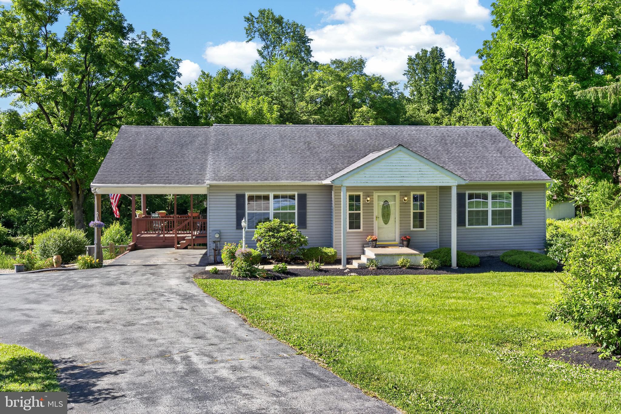 Welcome to 311 Hillendale Road, a warm and inviting 3-bedroom, 2-bath ranch home set on a picturesque 0.70-acre lot just outside the Kennett Square border. Although the mailing address is Avondale, the location feels wonderfully connected to Kennett Square, New Garden Shopping Center, local restaurants, fitness options, and everyday conveniences — all just minutes away. If you are looking for peace and tranquility while staying close to the heart of Kennett, this home is for you.

From the moment you arrive, the home feels comfortable, well cared for, and easy to enjoy. Inside, the main living spaces are filled with natural light and thoughtfully arranged for everyday living. Premium light, wide-plank waterproof laminate flooring with a wood-stamped finish adds warmth, style, and everyday durability to the living room, dining room, primary bedroom, and Bedroom 2. The front windows also feature versatile blinds that can be raised from the bottom or lowered from the top, allowing you to enjoy natural light while still maintaining privacy.

The living room and dining room flow naturally together, creating a welcoming space to gather, relax, or entertain. The eat-in kitchen features tile flooring, a tile backsplash, stainless steel appliances, a propane gas range, wood cabinetry, laminate countertops, a large pantry, and easy access to the rear covered deck and parking area — perfect for bringing in groceries, grilling, or stepping outside with a morning cup of coffee.

The main level includes 3 spacious bedrooms and 2 full bathrooms. The primary bedroom offers premium wide-plank waterproof laminate flooring, a double closet, ceiling fan with light, attic access, and direct access to a full en-suite bath with a walk-in shower, double vanity, linen closet, walk-in closet, and LVT flooring. Bedroom 2 also features premium wide-plank waterproof laminate flooring, a double closet, and ceiling fan with light. Bedroom 3 offers wall-to-wall carpeting, a double closet, and ceiling fan with light. A second full hall bathroom with a tub/shower combination, tile flooring, vanity, and nearby linen closet completes the main floor.

The current owners have made thoughtful improvements, including premium light, wide-plank waterproof laminate flooring in many main-level spaces, newer central air conditioning, and a new propane forced air furnace replaced in 2025. Prior updates include a newer roof and a hot water heater installed in 2021, along with a new French drain system in the lower level for added peace of mind.

Downstairs, the spacious unfinished walk-out lower level offers wonderful flexibility and room to dream. With approximately 41’ x 32’ of space, 8-foot ceilings, block construction, and a laundry area with utility sink and storage shelving, this level provides excellent potential for storage, hobbies, a workshop, fitness area, recreation space, or future finishing.

Out back, the covered deck overlooks the peaceful yard and offers a lovely spot to dine outside, relax, or enjoy the surrounding greenery. The backyard is fully fenced with post-and-rail fencing and wire mesh, creating a private and practical outdoor setting. A three-car parking turnaround area adds everyday ease.

With comfortable one-floor living, 3 spacious bedrooms, meaningful updates, a beautiful lot, private well, public sewer, New central air (2023), a new propane furnace (2025), and a location close to Kennett Square, New Garden Shopping Center, Hockessin, Wilmington, Newark, and more, 311 Hillendale Road is a home that feels welcoming from the very first visit.