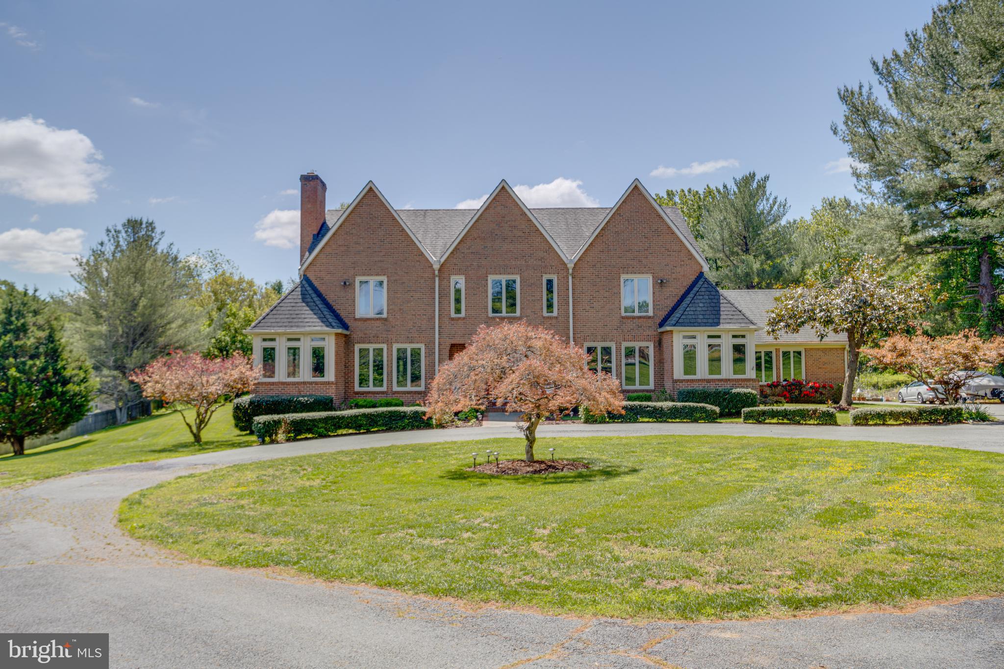 Experience Luxury, Privacy, and Outdoor Living in Potomac

Nestled on a picturesque two-acre lot within one of Potomac’s most sought-after neighborhoods, this remarkable estate seamlessly combines classic elegance with the modern comforts that discerning buyers desire. Surrounded by lush, mature landscaping, this five-bedroom home offers unparalleled privacy and a perfect blend of sophistication, comfort, and resort-style outdoor living.

Upon arrival, you are greeted by impressive architecture, sweeping grounds, and inviting curb appeal. Step inside to discover spacious, light-filled living spaces crafted for both everyday enjoyment and effortless entertaining. Generous room sizes and a seamless connection between indoor and outdoor areas create an environment that is both welcoming and functional. The primary suite is a true retreat, featuring a luxurious steam shower for ultimate relaxation.

The walk-out basement offers additional living and entertaining space, including a private sauna—perfect for unwinding after a long day—and a separate entrance, providing flexibility for guests or multi-generational living.

The backyard is a sanctuary unto itself. Spend summer afternoons lounging by the spectacular pool, host memorable gatherings on the expansive patio, or simply unwind amidst the tranquil beauty of the surrounding landscape. With 2 acres of usable outdoor space, this property offers exceptional privacy and versatility, while remaining conveniently close to Potomac Village, top-rated schools, parks, shopping, and major commuter routes.

Whether you’re entertaining guests, enjoying quiet evenings by the pool, or making cherished memories with family and friends, 30 Piney Meetinghouse Ct presents a lifestyle that is both elegant and relaxed—set in one of Potomac’s finest locations.