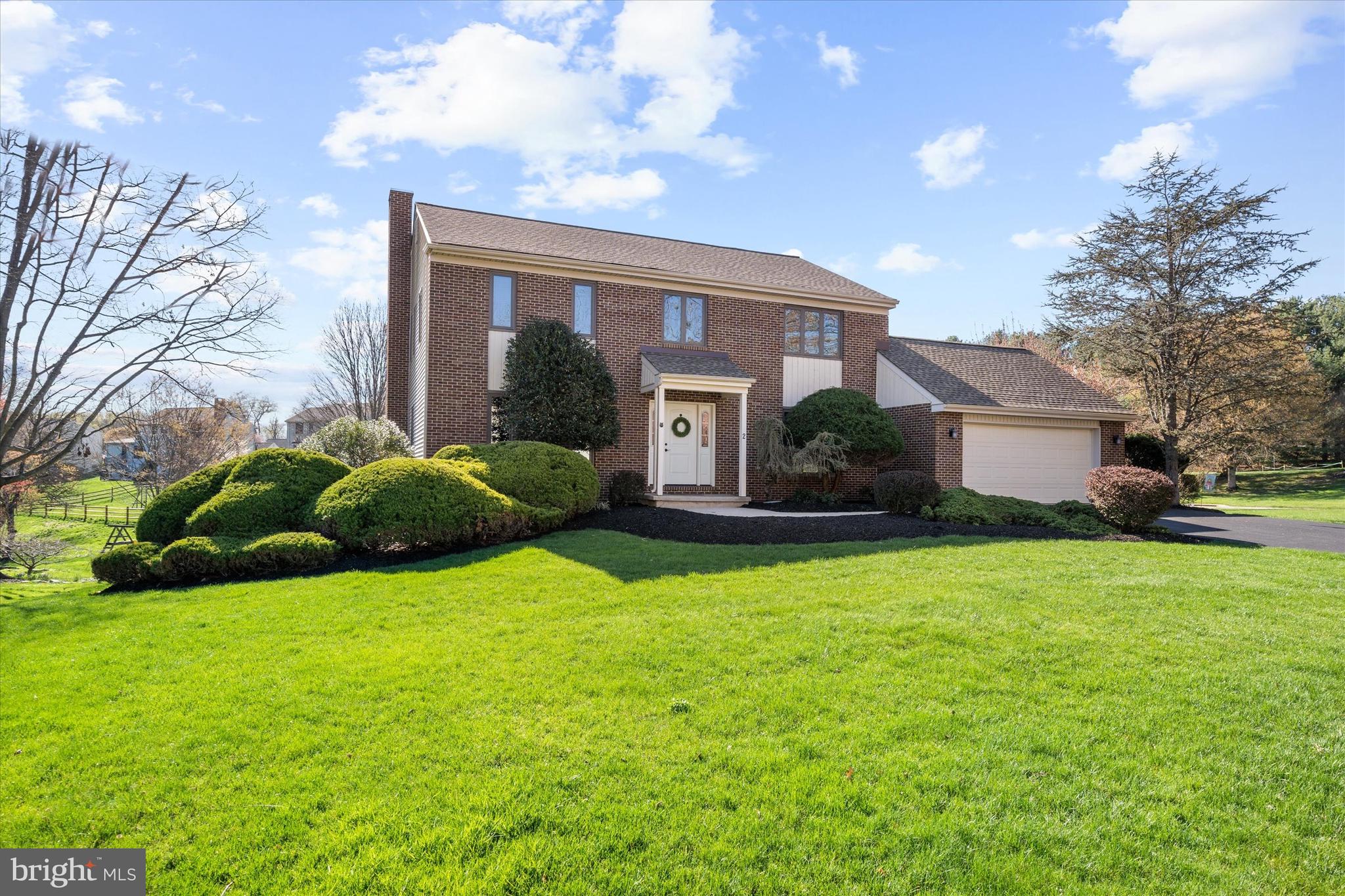 Welcome to this stunning 4 bedroom, 2.1 bathroom Colonial-style gem nestled in the highly sought-after Beech Hill neighborhood. Enter from the covered front porch into the wide foyer with gleaming hardwood floors leading into the spacious, light-filled living room with recessed lighting and newer carpeting. The entry is flanked by the formal Dining Room-perfect for entertaining. The light & bright Family Room boasts a wood-burning stacked stone fireplace encased by custom-built bookcases- this large room flows seamlessly to the rear composite deck, setting the stage for perfect indoor-outdoor living. The updated kitchen has ceramic tile flooring & backsplash, an island with pendant lighting, and 42" cabinets. The stainless steel appliances including a double oven, ample eat-in breakfast area, and walk-in pantry complete the Kitchen area. The first floor also has a convenient laundry room with direct access to the rear and a den that could also serve as a possible 5th bedroom or study. As you ascend to the second floor, you'll find four generous sized bedrooms. The primary bedroom has a renovated en-suite bathroom, a large walk-in closet, dual sinks, a heated floor, and a floor-to-ceiling ceramic tile shower. Completing the upper-level is a beautiful hall bath for the comfort of guests. Updates include the roof and vinyl siding (4 years); HVAC (12 years) ; almost all windows are newer; Composite deck (5 years) and hot water heater (2 years). The expansive lower-level recreation room awaits with recessed lighting, Berber carpeting, and walk-out access. Here, you'll find a separate room for exercise or multipurpose use along with plenty of storage space. The outdoor areas are equally impressive with a newer composite deck and paver patio overlook gorgeous, landscaped grounds: ideal for grilling, entertaining, or simply soaking up the sun. Beech Hill is conveniently located near shopping, dining, the University of Delaware campus and the Hockessin Athletic Club. 
Don't miss out on this beauty!