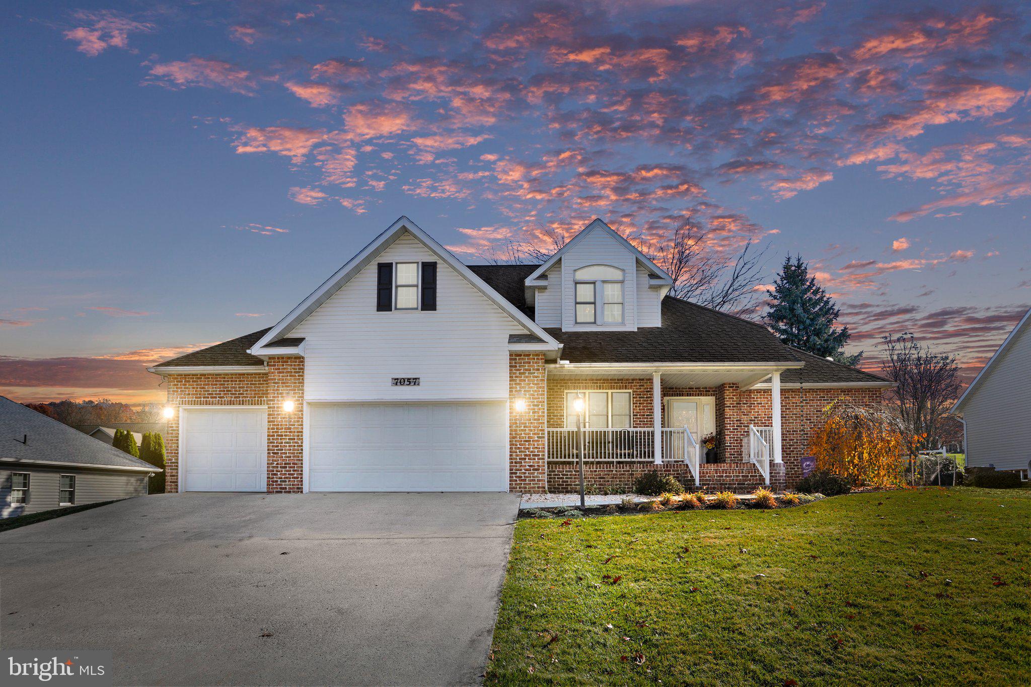This home abounds in features that are sure to delight the most discerning buyer. The inviting front porch welcomes you to a foyer that presents the option of entering a formal dining area or continuing a short distance to a large living room with cathedral ceiling and gas fireplace. This double sided fireplace is also enjoyed from the large eat-in kitchen which  features an island, new granite countertops, newer appliances and plenty of light with pleasant views of the back yard.  Off the expansive kitchen is a powder room and laundry room.  Everything on this level is freshly painted too.  Completing the main level is the primary bedroom with tray ceiling, walk-in closet and large bath which features a whirlpool tub, stall shower and dual sink vanity and new flooring, too. The 3 remaining  bedrooms and another full bath are upstairs. An additional bonus room on this level is currently serving as an office. The large finished basement provides opportunity to entertain sizeable gatherings and offers additional storage as well. The gas furnace, AC and hot water tank are newer. Recessed lighting, skylights and ceiling fans bring comfort to every room. There is plenty of space for larger families and, with the primary bedroom on the main floor, also the ability for single level living. The extended 3 car garage offers ample space for your cars and hobby or craft projects. Outside, laborious tasks like mulching, weeding and watering the lawn are things of the past. All of the mulch has been replaced with stone and the sprinkler system keeps your lawn healthy and vibrant throughout the warmer months. You can instead; spend your outdoor time enjoying the covered front porch for morning coffee, relaxing or entertaining on the rear composite deck under the shade of mature trees and a retractable awning. On cool evenings, the fire pit beckons for enjoyable nights under the stars by a warm fire. This gorgeous home will active for showing on or about December 28.