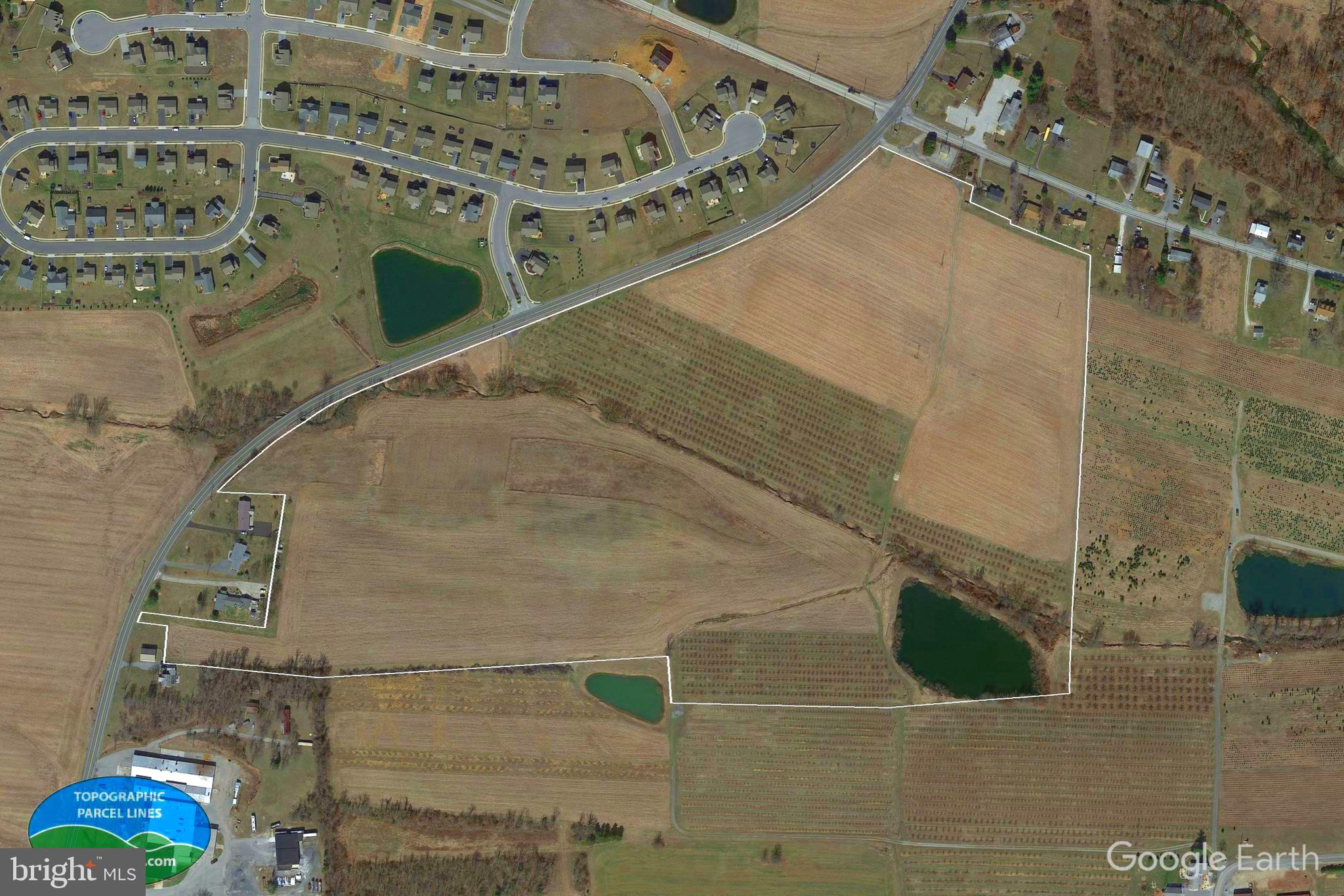 Property has access to Columbia Gas line, there is  Met-Ed & Adams Electric on site.  The property has 2 wells.  Public water & sewer may be available depending on desired use.  A narrow strip on the property in the middle is is a flood zone.  Land consists of 1 wooded acre, 1 acre of water (pond), 56 open space acres of tillable (beans/corn) & orchards.  There is a stream & some high ground with incredible views.  Ample road frontage & other additional side accesses.  Sellers may consider selling land in 2 parcels.  Highway traffic consists of approx. 11 vehicles per minute during the mid-afternoons during the week.  Property is in the fruit belt near Motts/Cadbury Swepps, Knouse Foods, Musselmans, railway & residential development.