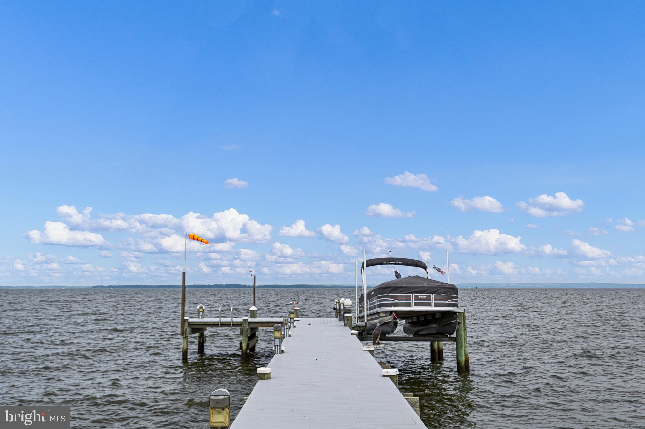 COMING SOON!!  Don't miss this rare opportunity to own a beautifully upgraded waterfront home in the highly sought-after community of Bay View Estates, offering breathtaking panoramic views of the Chesapeake Bay and iconic Turkey Point Lighthouse.

This beautiful 4-bedroom, 2-full-bath home has been thoughtfully updated and is designed to maximize both comfort and entertaining. From the moment you enter, you'll appreciate the stunning hardwood floors, abundant natural light, and spectacular water views from nearly every room in the home.

The inviting sunken living room features a cozy wood-burning fireplace, creating the perfect gathering space year-round. The spacious kitchen is ideal for entertaining, complete with ample workspace, a wine refrigerator, and seamless flow to multiple indoor and outdoor living areas.

Step outside and enjoy true waterfront living with expansive decks stretching across the rear of the home and a large screened porch on the side—perfect for relaxing, dining, or taking in the incredible sunsets over the Bay.

The newly finished walk-out basement adds valuable living space, featuring a bedroom and full bath, making it ideal for guests or weekend visitors. With generous sleeping accommodations throughout, this home is perfectly suited for entertaining!

Boaters will appreciate the newly upgraded private dock and boat lift, while the new enhanced bulkhead is currently being completed for added peace of mind and long-term shoreline protection.

The beautifully maintained landscaping complements the home's natural surroundings, creating a private waterfront retreat you'll enjoy in every season.

Bay View Estates residents enjoy access to a private community waterfront area featuring a boat ramp and pier, making it easy to embrace the Chesapeake lifestyle. Spend your days fishing, crabbing, boating, or simply relaxing by the water.

Whether you're searching for the perfect weekend getaway or a year-round waterfront residence, this property offers the best of Chesapeake Bay living.

Professional photos are coming soon, and the property is scheduled to hit the market just in time for the 4th of July weekend. Start making memories on the Bay this summer—opportunities like this don't come along often!