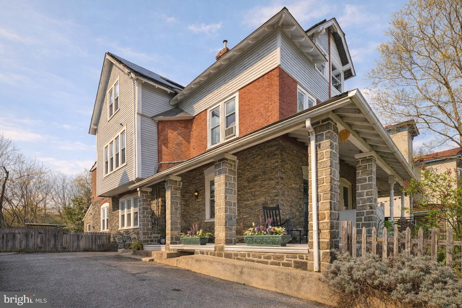 What’s it like to live in a historic Germantown home with a private garden, fruit trees, and a separate cottage?
It feels like having your own peaceful retreat, right in the heart of Philadelphia.

Welcome to 423 E High St, a beautifully preserved and thoughtfully updated Victorian twin in the historic Germantown neighborhood of Philadelphia, where timeless architecture meets modern comfort and an unmatched urban homestead lifestyle.

Set on a generous lot with a rare private driveway accommodating 3–4 cars, this 6-bedroom, 2-bath home offers over 2,760 square feet of living space, plus a fully insulated 680 sq ft cottage that opens the door to endless possibilities, from a home office to an artist’s studio or private retreat.

Step onto the expansive wraparound porch, now refreshed in soft modern tones, and imagine slow mornings with coffee or relaxed evenings surrounded by greenery. Inside, the home showcases original hardwood floors, high ceilings, and abundant natural light, all enhanced by updated neutral finishes that create a warm, move-in-ready feel while preserving its historic character.

The kitchen is both functional and full of personality, featuring butcher block countertops, heated floor, updated appliances including an induction cooktop, and a central island perfect for gathering, cooking, and entertaining. Just beyond, a renovated full bath with heated flooring and mudroom add convenience for everyday living.

Upstairs, six spacious bedrooms across two levels offer flexibility for families, guests, or work-from-home setups. The second-floor bathroom blends modern updates with classic charm, while large windows throughout the home frame views of the lush gardens surrounding the property.

Out back, the experience becomes truly special. The expansive yard is a gardener’s dream, with nutrient-rich soil, established perennial herbs and flowers, and a collection of mature fruit trees including peach, fig, cherry, elderberry, Juneberry, and grapevines. Whether you envision growing your own food, hosting outdoor dinners, or simply enjoying a quiet escape, this space delivers.

Tucked within the garden, the detached cottage offers a rare bonus space with high ceilings, large windows, and its own wood-burning stove, creating a cozy yet inspiring environment ideal for creative work, remote business use, or a private guest retreat.

Additional upgrades include solar panels, a newer roof (2019), updated electrical systems, and renovated kitchen and baths, offering both efficiency and peace of mind. The home is heated by a gas furnace with radiator heat, combining classic comfort with reliability.

Located just minutes from Wissahickon Valley Park and Awbury Arboretum, and within easy access to two SEPTA regional rail lines, this home offers the perfect balance of nature, convenience, and historic Philadelphia charm.

If you’ve been searching for a Germantown Philadelphia home with land, parking, and flexible living space, this is a rare opportunity to own something truly special.