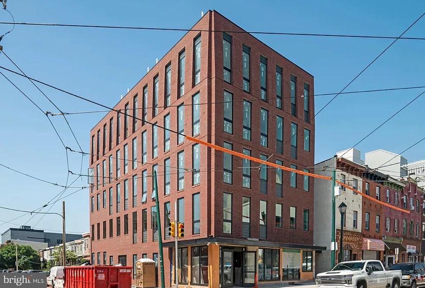 The Bordeaux is a trophy-quality, purpose-built multifamily asset completed in 2022. The building's striking brick and curtain glass facade along West Girard Avenue creates immediate visual identity and strong neighborhood presence, while the residential floors above offer thoughtfully designed studio, one-bedroom, and two-bedroom residences with premium finishes throughout. Delivered new in Q4 2022, the building represents the highest standard of new construction multifamily in Brewerytown. Each residence features stainless steel appliances, quartz or stone countertops, luxury vinyl plank flooring, subway tile bathrooms, in-unit washer/dryer, and individual mini-split HVAC systems —amenities that drive premium rents and best in class resident retention.