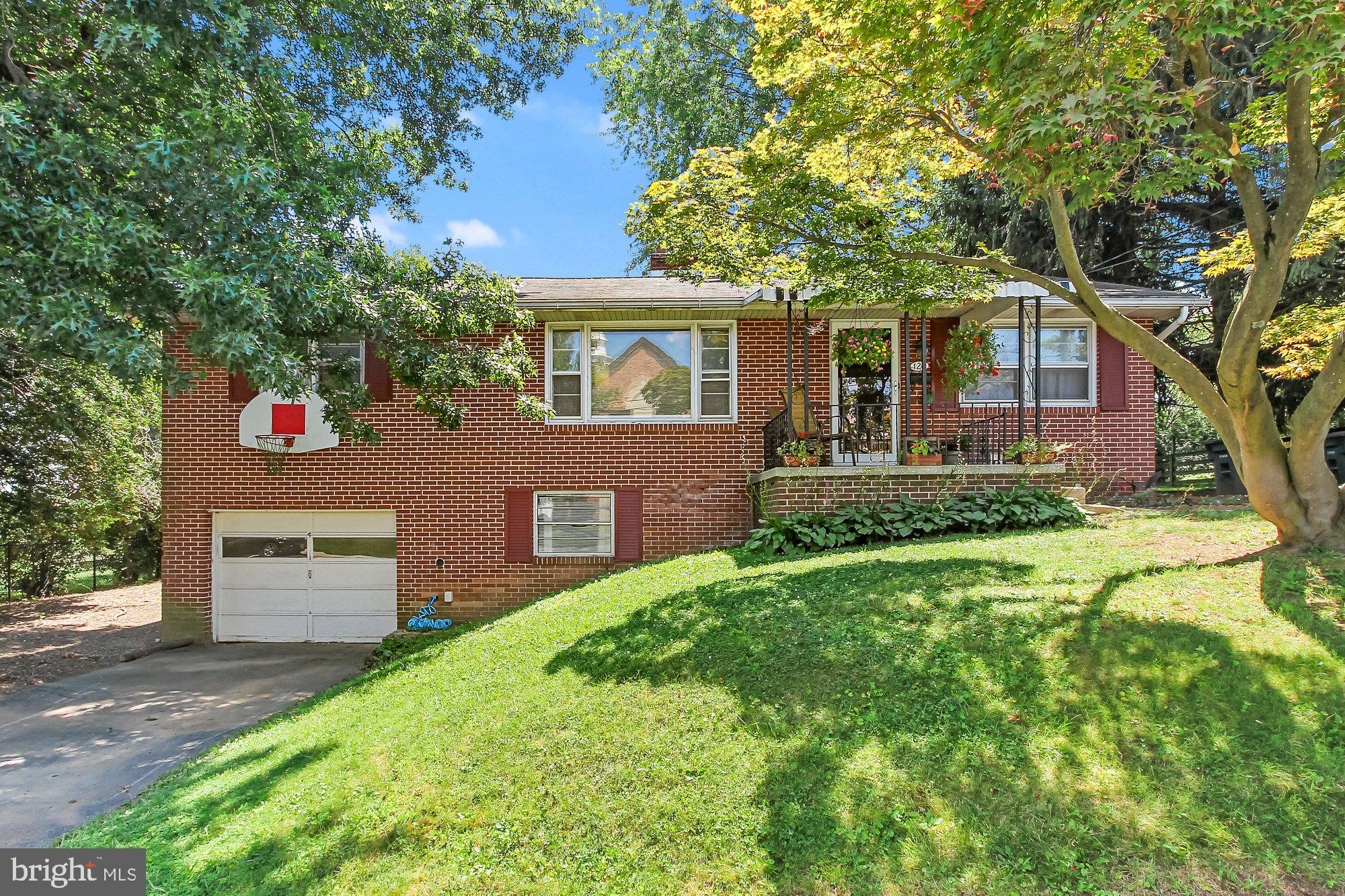 Brick rancher located in Central School District.  This home offers  a large living room with new flooring and brick fireplace    spacious kitchen that leads to  dining area and 3 bedrooms with hardwood floors .
Lower level partially finished  with a 2nd fireplace in rec room.  There s a 2nd room on this lower level that would be great as a 4th bedroom or used for a workout room or office ! Lots of possibilities here.   You can enjoy evenings on the front porch or the enclosed  back sun porch. Plenty of room to entertain   the lot is .31!! Located close to RT 83 and 30, close to shopping and all conveniences. Property being sold AS IS.