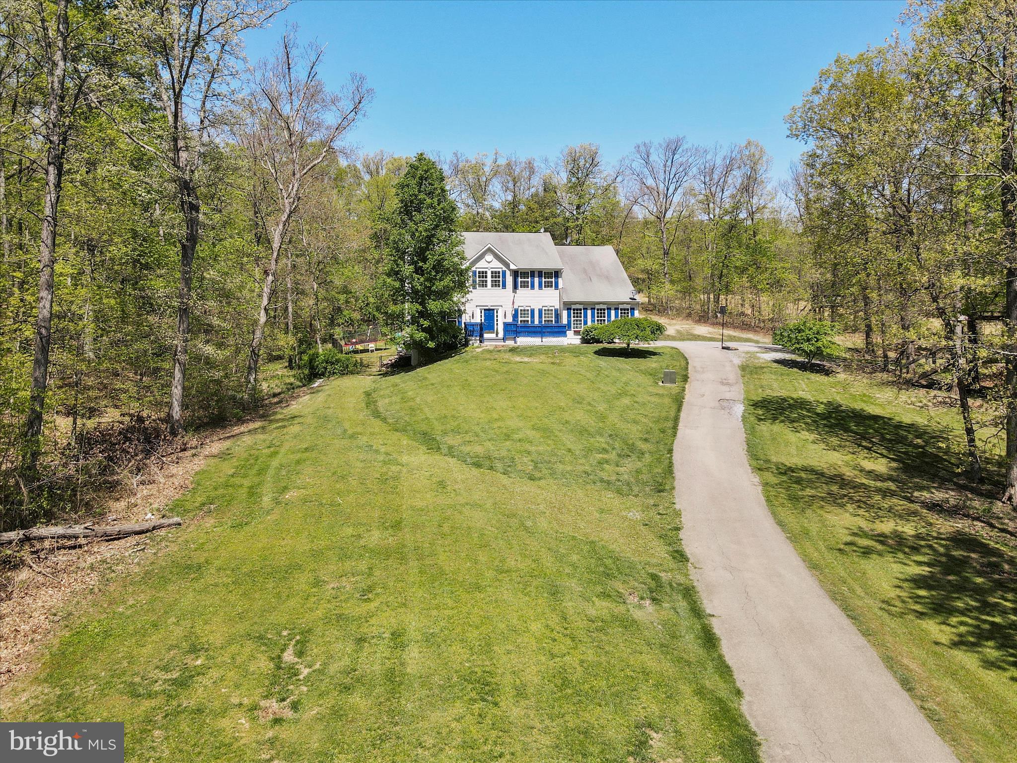 This stunning home, nestled on nearly 4 acres, is the perfect retreat you've been searching for. From the moment you step inside, you'll be captivated by its abundant amenities and spacious layout. The main level features a grand two-story foyer, elegant formal living and dining rooms, a kitchen equipped with new stainless steel appliances and an attached breakfast room, a convenient half-bathroom, laundry room, and a generous sunken living room with a cozy gas fireplace. Upstairs, the luxurious master suite includes a large walk-in closet and a private full bathroom with a soaking tub and separate shower. Three additional bedrooms and another full bathroom complete the upper floor. The finished basement offers even more living space with a full bathroom, a family room, and a recreation room, perfect for entertainment or relaxation. Outside, the expansive deck is ideal for hosting family and friends, while the above-ground pool provides a refreshing escape on warm days. This property truly has it all, offering both comfort and elegance in a serene setting. Call today to schedule a tour!