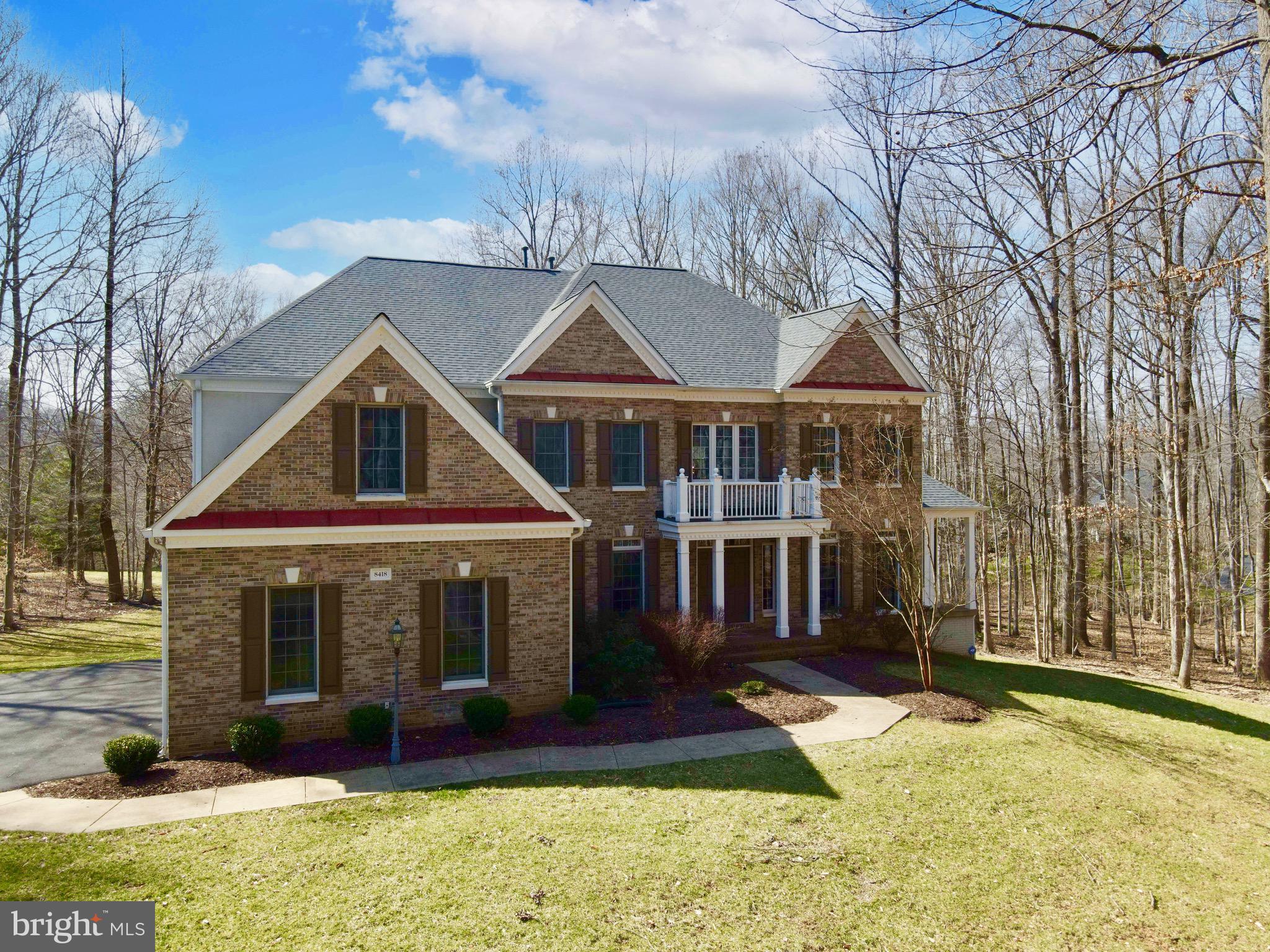 This 3 car garage home sits on over 5 acres, backs to trees and is absolutely stunning, inside and out! Updated and renovated with beautiful gourmet kitchen perfect for entertaining and flooded with natural light overlooking gorgeous serene surroundings. Family room with vaulted ceilings and two sided fireplace joining with a spacious sunroom ideal for easy relaxation.  Stunning master suite with spa tub, large shower stall, 2 separate vanities, huge walk in closet and incredible views. The backyard features a HUGE deck, great for fun summer evenings, BBQing and entertaining! Major system updates include brand new 50k spent Roof (2022), Water Heater (2020), Well Pump (2020), Filtration (2016), Sump Pump (2016). This gorgeous home won't last long! Come see and experience this luxurious home for yourself, there is A LOT to check out!