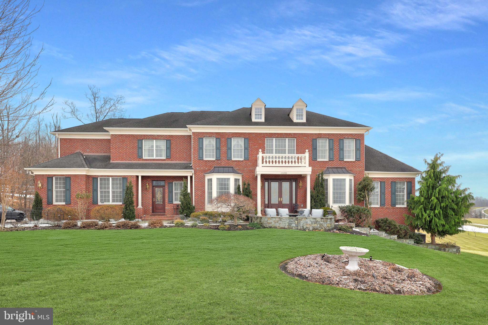 Exquisite Estate Living on 3+ Private Acres in Waterford Ridge.  Welcome to an exceptional luxury residence nestled on a peaceful cul-de-sac in the highly desirable Waterford offering over 7,600 square feet of beautifully appointed living space across three finished levels. 
Situated on approximately 3.3 private acres, this elegant brick estate seamlessly blends timeless architectural design with extensive high-end upgrades, thoughtful custom expansions, and resort-style outdoor living.
The heart of the home is the spectacular chef’s kitchen featuring premium GE Appliances Monogram appliances, upgraded granite countertops, an oversized center island in the Palladian kitchen addition, wine cooler, and a second pantry — all opening to the dramatic two-story family room expanded by six feet with open beamed ceiling, curved balcony with iron balusters, shadow box molding, and a stunning wood-burning fireplace with upgraded mantel and surround. Elegant formal living and dining rooms showcase tray ceilings, bay windows, chair rail shadow box molding, and designer smoked bronze mirror accents, while the private study offers a full wall of custom built-in cabinetry. 
A bright conservatory with additional built-ins provides flexible living or entertaining space. Upstairs, the luxurious primary suite features a coffered ceiling, spa-inspired bath with ceramic wrapped columns, floor-to-ceiling mirrors, clean glass shower, soaking tub with coffered ceiling detail, and generous walk-in closet. Secondary bedrooms are spacious and well appointed, while the upgraded laundry room includes extensive shelving and mesh drawer organization. 
The fully finished walk-out lower level is designed for entertaining and relaxation with a raised stone wood-burning fireplace, full stone accent wall, built-in cabinetry, window seating, custom bar, and guest accommodations. 
Outdoor living is equally impressive with a custom deck, expansive rear patio, front patio, professional hardscaping, landscape lighting, and beautifully maintained grounds. The home also features premium ProVia front entry doors, a whole-house Generac Power Systems generator, three HVAC systems (replaced 2021), upgraded flooring throughout, and a 3-car side-load garage. 
This extraordinary property offers privacy, sophistication, and convenience — a rare opportunity to enjoy refined estate living in one of Loudoun County’s most picturesque settings.
