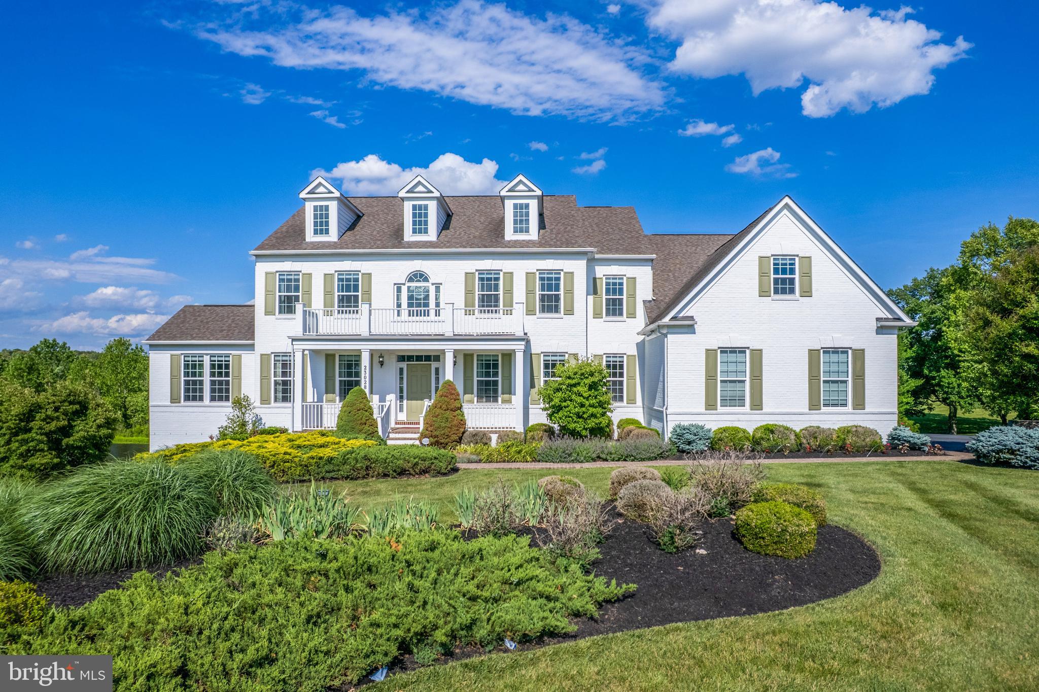 Experience the pinnacle of refined living in this magnificent 7,420+ square foot contemporary estate, standing as a landmark of architectural distinction within the prestigious Huntleigh at Creighton Farms. Meticulously master-crafted by Stanley Martin, this former model home is an embodiment of stately elegance, defined by its commanding presence, soaring ceilings, and a seamless blend of sophisticated design and exceptional craftsmanship. The residence unfolds with grace, offering distinguished living spaces including a gourmet chef’s kitchen, a stately library for quiet contemplation, and an expansive lower-level retreat, all finished with the finest materials. With 5 large bedrooms and 5.5 luxurious baths, and a super oversized principal bedroom closet to store all of your shoes/clothes/garmets. The home provides an atmosphere of unparalleled comfort and refined privacy.

The exterior is a testament to natural beauty, seamlessly integrated with professionally curated landscaping and mature plantings that provide both color and structure throughout the seasons. The grounds extend gracefully to the water’s edge, where the property’s allure is underscored by a serene, lighted pond that serves as a private oasis and ads to the view. This idyllic waterfront setting offers a unique luxury—exclusive access to catch-and-release fishing right from your own backyard. Residents may transition from the home’s newly installed Trek deck to an expansive, hardscape patio with built in fire pit that serves as the ultimate gathering spot for evenings under the stars.

Beyond its aesthetic majesty, this estate is engineered for the discerning owner, featuring a suite of high-end, proactive enhancements designed for longevity and ease. Notable upgrades include a whole-house electrical backup generator, a sophisticated total-home water filtration system with integrated hard water treatment and UV sterilization, and a state-of-the-art security system complete with comprehensive interior and exterior camera surveillance. Practical luxury meets modern innovation with the addition of a dedicated Tesla EV charger. Situated in one of Loudoun County’s most exclusive enclaves, this property offers more than a residence; it provides a legacy of prestige, tranquility, and turn-key perfection for the most demanding buyer.