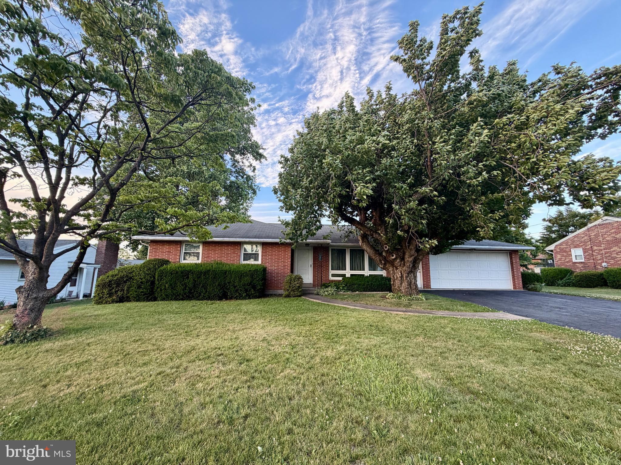 Charming and move‑in ready, this all‑brick ranch home delivers comfort, convenience, and an impressive amount of finished living space.

Step inside to find replacement windows, central air, and dual‑zone heating that keeps the home comfortable year‑round. The kitchen features oak cabinetry with all appliances included, making it easy to settle right in. With 2 full baths, everyday living stays effortless.

The lower level is a standout, offering over 900 sq ft of finished space complete with a bar, a family room, two additional rooms, a full bath, and a laundry/utility room—ideal for entertaining, hobbies, guests, or extended living needs.

Outside, enjoy a spacious screened porch that has a built-in cooking area, a nice level lot, a shed, and an oversized garage that provides excellent storage and workspace. And with the township park just down the street, recreation and green space are always close by.

A well‑cared‑for home with exceptional bonus space—this one checks all the boxes.