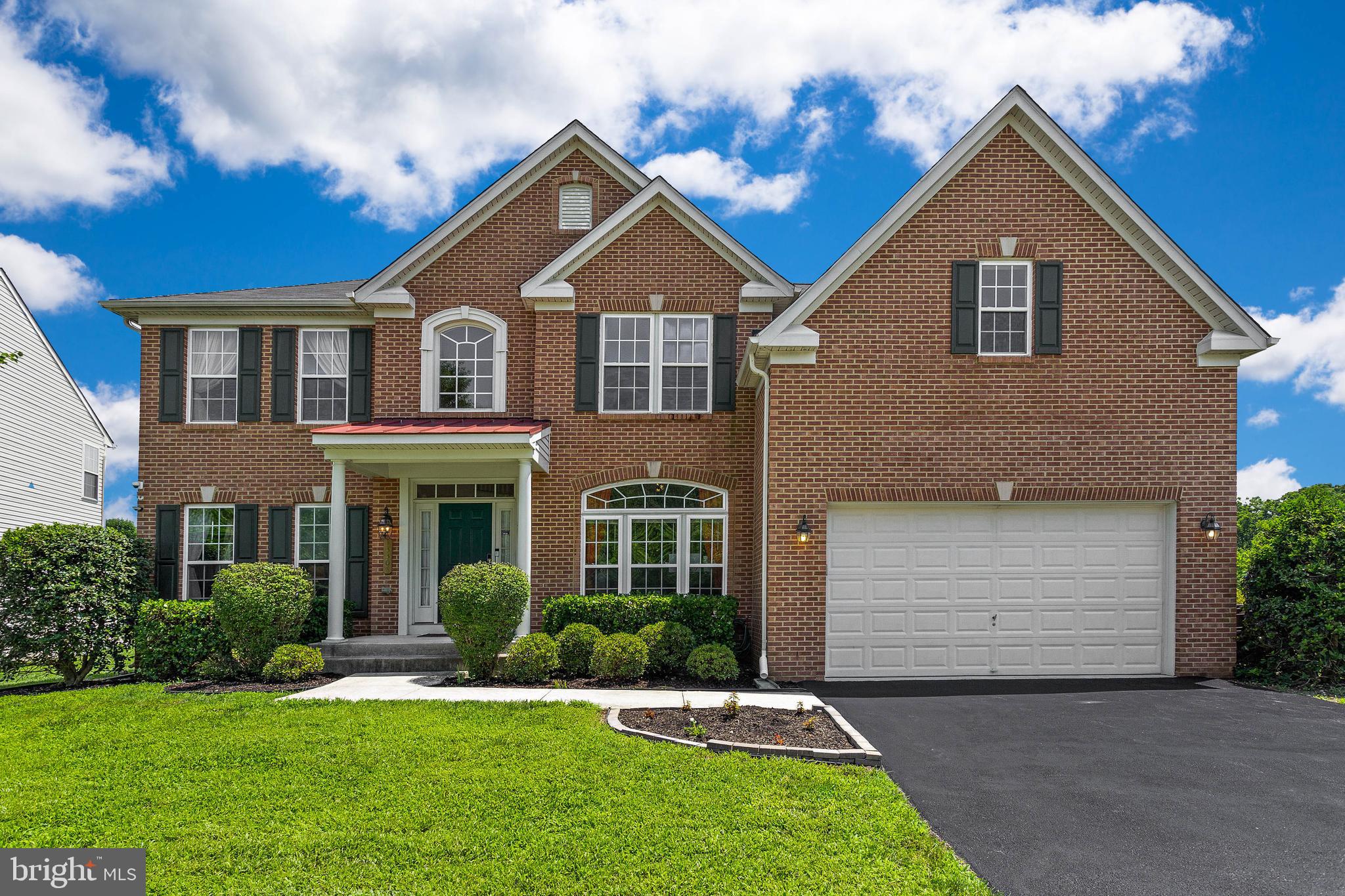 Beautiful 5,024 SQFT home with finished basement appt perfect for in-law(s)!  Nestled in a quiet family-oriented community, this home features an open floor plan on all 3 levels with a total of 6 bedrooms, 3.5 Baths.  The updated gourmet kitchen has all stainless-steel appliances, granite counter tops, gas cook top, icemaker/filtered water dispenser, double oven, large kitchen island leading into the over-sized sunroom with ample natural lighting.  The sunroom features a view overlooking the community lake w/ walk/jog path.  The backyard has large paver patio and spacious yard.  Great room has vaulted ceiling, stone covered gas fireplace w/ mantel, brand new hard wood flooring, 5.1 flush mount surround sound system and large windows w/ ample natural light.  4 bedrooms upstairs all have walk-in closets. The Primary bedroom has his and hers walk-in closets, primary bathroom w/ separate vanities, shower, jetted soaking tub, ceramic tile flooring and large sitting room.  Living room and formal dining room have crown molding and bay windows.  Double/dual staircases, security system and whole house sprinkler system.  A/C and heating system w/ forced air/electric. Fully Finished walk-out basement with 2 bonus rooms, which can be used as office, den or storage room, kitchenette.  PERFECT for In-Law Suite!!