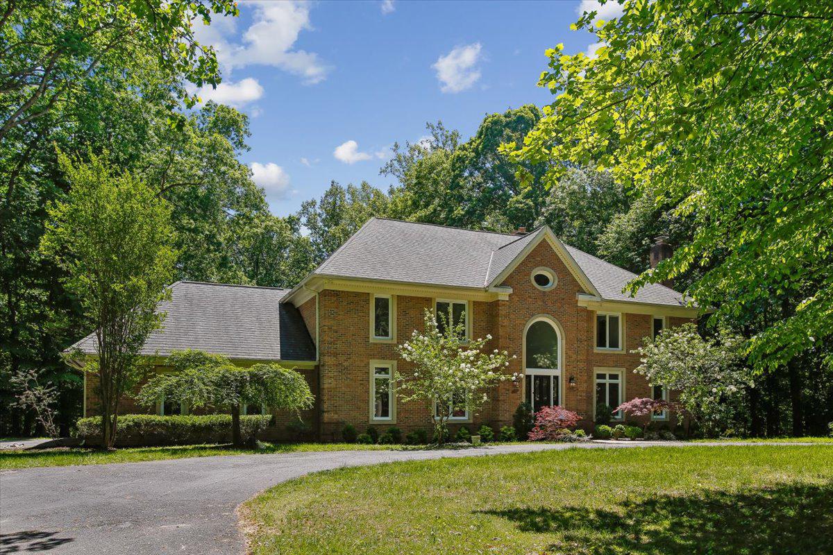 First Open Sunday, June 7, 1-3 PM
Set on a spectacular level lot in the prestigious Falconhurst community of Potomac Village, this extraordinary 5 BR 5FBA 2 HBA & 6,000 sq ft estate showcases soaring ceilings, timeless architectural elements, grand-scale living, and sophisticated modern renovations across every level.  ALL NEW updates for 2026 include NEW ROOF, new 2nd floor HVAC, new gourmet KITCHEN, new paint, new electrical, newly refinished floors, and more updates throughout, beckoning you to this extraordinary home on a level two acre lot on prestigious Newbridge Drive. Rarely does a property in Falconhurst offer such beautiful usable land with expansive green space, creating a bright, open, and versatile outdoor environment.
A soaring two-story atrium welcomes you inside, where dramatic ceilings, magnificent Palladian windows, and exquisite architectural details create an atmosphere of refined luxury. The formal sunken living room is centered around one of four wood-burning fireplaces, designed for elegant entertaining and adjacent to a newly renovated powder room and nearby wood-paneled study, complete with its own fireplace and custom craftsmanship that has made this space a cozy haven. At the heart of the residence, the spectacular family room stuns with cathedral ceilings, a floor-to-ceiling stone fireplace, custom built-ins, and seamless access to the expansive outdoor deck. Adjacent, a beautifully newly renovated entertaining bar creates the perfect setting for intimate gatherings or large-scale celebrations. The fully renovated chef’s kitchen is a showpiece of modern luxury, featuring custom Shrock cabinetry, striking quartz countertops, and an exceptional suite of premium appliances including Thermador induction cooking and refrigeration and Viking wall oven, microwave, dishwasher and under-counter refrigeration. A newly redesigned Butler’s pantry enhances both function and style, while the formal dining room impresses with elegant millwork, chair railing, and refined detailing ideal for sophisticated entertainment. Additional main-level highlights include a renovated laundry room with custom cabinetry, a second updated powder room, and an oversized three-car side-entry garage. Outside, the property continues to impress with one of the community’s most coveted features: a rare, spacious and level backyard designed for both relaxation and entertainment. The outdoor retreat includes a charming gazebo, built-in seating, mature landscaping, and sweeping stair access from the deck. Newly replaced Palladian windows (2025) further elevate the home’s beauty and efficiency.
Upstairs, four generously sized bedrooms offer beautifully renovated en-suite and Jack-and-Jill marble baths, oversized closets, and exceptional natural light. The lavish owner’s suite serves as a private sanctuary, featuring rich hardwood flooring, dual walk-in closets with custom ClosetMaid organizers, and a spa-inspired marble bath complete with a soaking tub and luxurious finishes throughout. The fully reimagined walkout lower level offers remarkable versatility and comfort. Highlights include a spacious fifth bedroom with en-suite bath and oversized walk-in closet, a beautifully renovated full bath with glass-enclosed shower and marble finishes, and an expansive recreation area anchored by the home’s fourth wood-burning fireplace. Designed for modern living and entertaining, the lower level also features a dedicated exercise room, media room pre-wired for audio and theater installation, multiple bonus rooms with generous storage, and a pre-planned kitchenette/bar area ready for future customization. This is an exceptional opportunity to own a truly distinguished residence where timeless architecture, luxury renovations, and extraordinary living spaces come together in perfect harmony. Welcome home to 9455 Newbridge Drive.