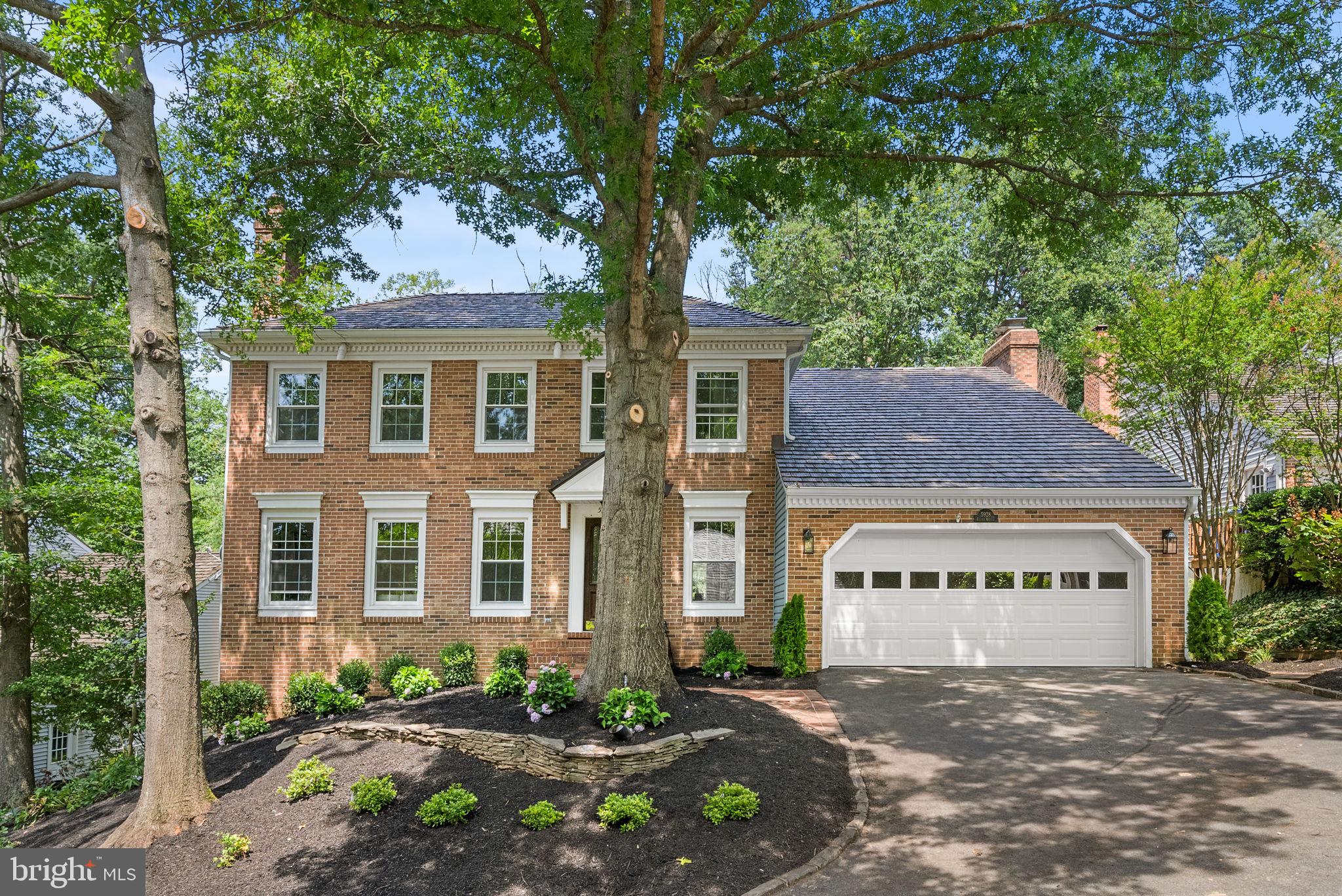 Beautifully Renovated Colonial with a Walkout Basement, Chef's Kitchen, and Private Backyard Retreat
Nestled on a quiet cul-de-sac in the sought-after Palisades community, this thoughtfully renovated Colonial blends timeless character with modern design. Every space has been carefully reimagined to create a home that is as inviting as it is functional, making it ideal for both everyday living and memorable gatherings.

Step inside to a light-filled living room anchored by a fireplace that creates a warm and welcoming focal point. Just beyond, the elegant dining room features a charming bay window, designer wall sconces, and serene views of the wooded backyard, creating the perfect backdrop for holiday dinners and everyday meals alike.

At the heart of the home, the renovated gourmet kitchen is designed for gathering. Quartz countertops, custom white cabinetry, stainless steel appliances, a dramatic waterfall peninsula, designer tile backsplash, and a sunny breakfast nook come together in a space that is both beautiful and highly functional.

Open to the kitchen, the family room is full of character with exposed beams, expansive windows overlooking the trees, and easy access to the outdoor living spaces. Whether you're enjoying a quiet evening or entertaining a crowd, this room offers a comfortable place to relax in every season.

Upstairs, the primary suite serves as a peaceful retreat with vaulted ceilings, skylights, a fireplace, a walk-in closet, and a spa-inspired bath featuring dual vanities, a soaking tub, and a separate glass-enclosed shower.

Three additional generously sized bedrooms and updated bathrooms provide flexibility for family, guests, or a home office.

The finished walkout lower level offers exceptional versatility with a large recreation room, fireplace, custom wet bar, renovated full bath, abundant storage, and direct access to the backyard. It's the perfect space for movie nights, game days, overnight guests, or a home gym.

Outside, the private backyard is surrounded by mature trees, creating a peaceful escape. The expansive multi-level deck and charming gazebo invite you to enjoy morning coffee, summer cookouts, or relaxing evenings outdoors.

Additional highlights include a new 2026 roof, an attached two-car garage, a beautifully updated powder room with designer wallpaper, a convenient laundry area, and abundant storage throughout.
Ideally located just minutes from Holmes Run Trail, neighborhood parks, shopping, restaurants, I-395, and less than 10 miles from Washington, D.C., this home also enjoys close proximity to the exciting WestEnd Alexandria redevelopment, adding new healthcare, shopping, dining, and community amenities to one of Alexandria's fastest-growing areas.

Beautifully updated and move-in ready, this is more than a home. It's a place where friends gather, holidays are celebrated, and memories are made for years to come.