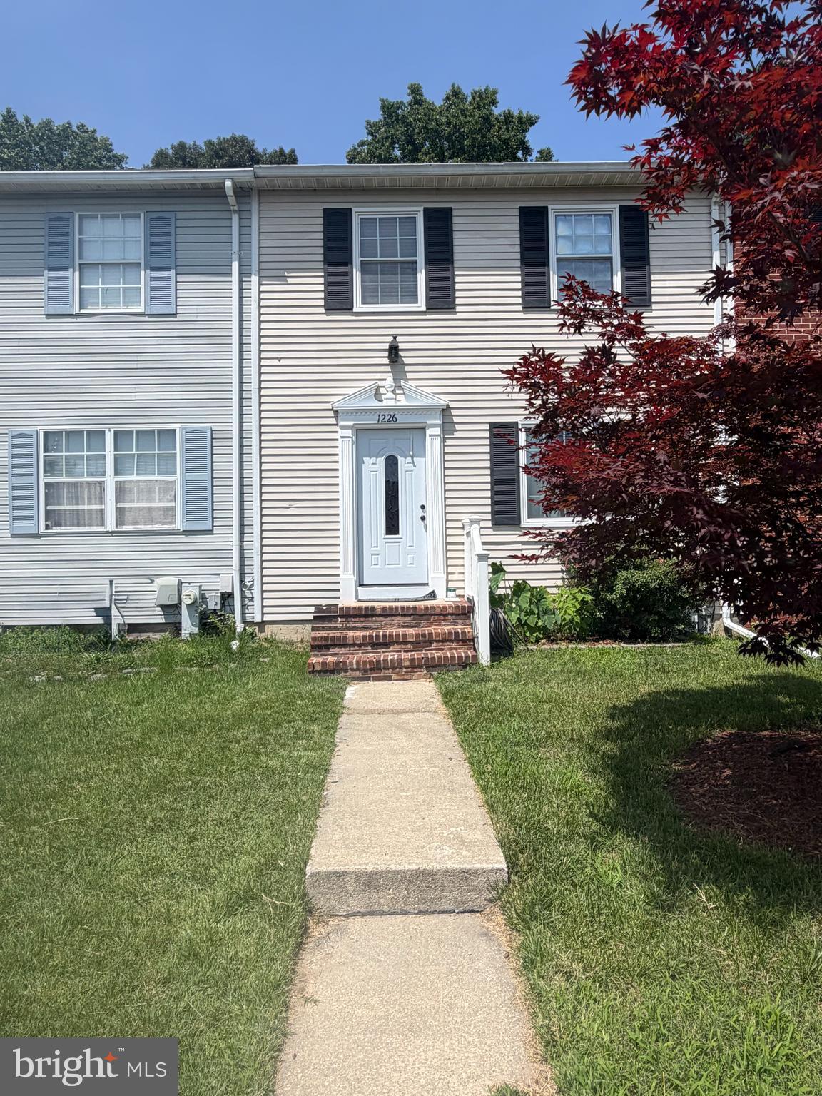 Welcome home to this inviting and well maintained townhouse offering 3 bedrooms, 2.5 baths, and comfortable living spaces designed for everyday living and entertaining. The finished basement provides additional living space with durable vinyl flooring, a washer and dryer, and a convenient outside entrance, making it perfect for a family room, home office, gym, or rec room.

At the heart of the home is a chef's kitchen featuring dark wood cabinetry, stainless steel appliances, granite countertops, two ovens, and a spacious eat-in area where family and friends can gather to share meals and create lasting memories. The bright and welcoming living room and dining room feature beautiful hardwood flooring throughout the main level, along with a convenient half bath.

Upstairs, retreat to the spacious primary suite offering plush carpeting, a ceiling fan, and abundant closet space. The private primary bath features a walk-in shower and vinyl flooring. Two additional bedrooms provide comfortable accommodations for family, or guests while the hall bath includes a tub/shower combination.

Step through the sliding glass doors and enjoy your morning coffee or evening gatherings on the back deck overlooking the fenced backyard, offering a wonderful space for relaxing, entertaining, or simply unwinding after a long day.

Outdoor enthusiasts will appreciate the community amenities, including a beach area with picnic tables, a boat landing, and a dock where you can enjoy fishing, crabbing, and taking in the peaceful waterfront setting. Nestled along Stoney Creek with access to the Patapsco River and the Chesapeake Bay, this community offers a lifestyle that blends comfort, recreation, and natural beauty.

Conveniently located near restaurants, shopping, and schools, with easy access to major destinations including approximately 30 minutes to historic Annapolis, 30 minutes to Baltimore, 20 minutes to Baltimore/Washington International Thurgood Marshall Airport, and approximately 58 minutes to Washington, D.C.