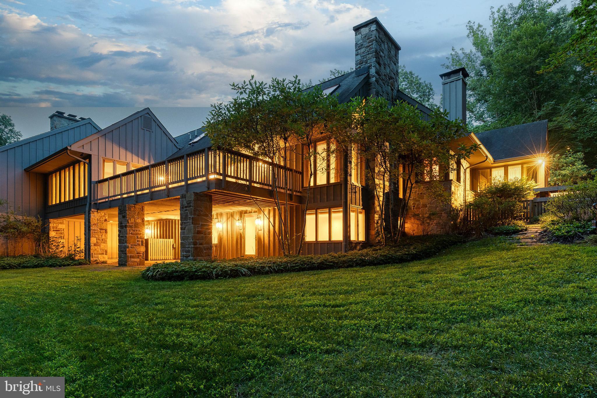 Live authentically. Incredible opportunity for embracing the coveted Rockland lifestyle. Experience this impeccably renovated home in one of the most private settings within the community. Interiors by the exceptionally talented designer, Stiles Colwill. Glorious, bright cooking space…be inspired to create and imbibe. Soaring ceilings in the great room, immense light. Flow seamlessly to your expansive deck…revel in the privacy and connect to nature. Vibrant woodlands in the distance. Retreat to your luxe owner’s suite with ample dressing room, generous lounge area and stunning bath. Handsome library with fireplace. Fully finished lower lever with additional great room and guest suites. Thoughtfully redesigned. The sense of spaciousness is palpable. Ample storage throughout. Gated community with tennis and pool. Minutes to everywhere you want to be…Greenspring Station, I-695 and I-83. Cultivate your existence. The art of uniting human and home.