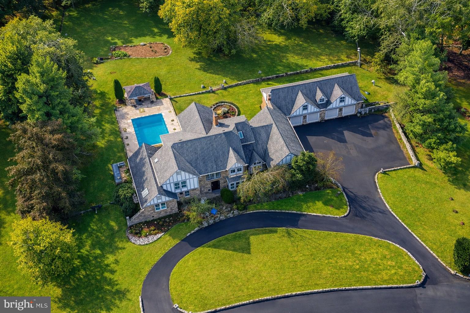 **Coming Soon! ***Welcome to an exceptional 2-acre luxury estate in prestigious Potomac, Maryland, this impressive brick single-family home is being transformed into a modern showpiece. A grand circular driveway and elegant gated entrance set the stage for a true retreat.  Designed for grand entertaining This home is an entertainer’s dream, offering dramatic 9+ foot cathedral ceilings and a second- floor overlook with views of the great room, sunroom, study, and media room. These open, light-filled spaces are ideal for hosting everything from intimate dinners to large celebrations, corporate events, or family gatherings. Two formal dining areas and a chef’s kitchen with premium finishes flow into a bright breakfast nook, creating a seamless setting for hosting guests.  Luxurious living and guest spaces the residence features a spacious private primary suite and a fully independent in-law suite with its own spa-inspired bathroom, perfect for multi-generational living or long-term guests. Additional upper-level bedrooms offer beautiful views across the property and provide comfortable accommodations for family or visitors. A private indoor pool area with a full bath and nearby gym creates a year-round wellness and relaxation zone within the home.  Resort-style outdoor amenities The expansive, fenced grounds back to tranquil woodlands and are designed for both play and relaxation. Outdoor amenities include a soccer field, basketball court, custom children’s playground, and a generous entertaining patio. A resort-style infinity pool with cabana and a stone fountain complete the backyard oasis, turning everyday living into a vacation-like experience.  Finishing touches and practical luxury Three fireplaces bring warmth and character to multiple living and entertaining areas, while large picture windows fill the home with natural light. A 4-car garage offers abundant parking and storage for vehicles and equipment. With its rare combination of size, privacy, amenities, and ongoing high-end renovation, this Potomac estate delivers a one-of-a-kind lifestyle for buyers who want space to live, relax, and entertain at the highest level.