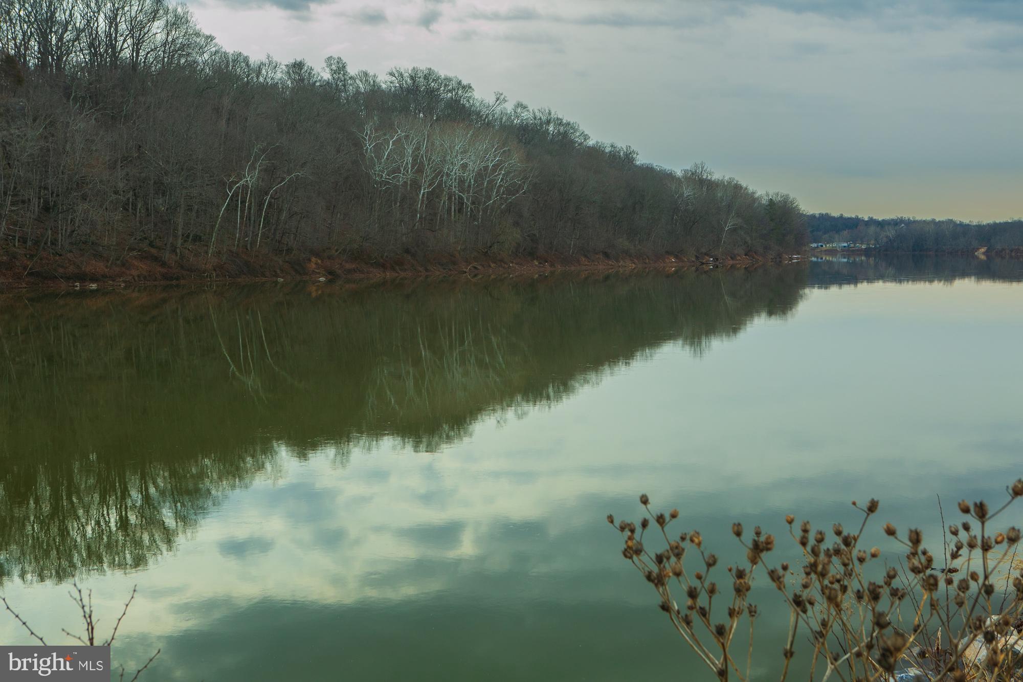 Rare opportunity to own a 5.5 acre wooded   Potomac Riverfront lot in desirable  gated  Crossings on the Potomac residential community,  Build your dream house and bring your boat. . Swim, fish, boat from your back yard.  The lot  has several hundred feet of direct frontage on the Potomac River.  Peaceful neighborhood of large lot sizes. 
Beautiful river views up and down the Potomac. The Crossings on the Potomac project contains private asphalt streets and  a private  large boat marina with a boat ramp and seasonal dock slips.  Enjoy the navigable deep water stretch of the  Potomac River .  Enjoy the natural beauty of this exclusive community. 
Convenient location with easy access close to highway I-81.  Minutes to MARC Commuter Train to DC in Martinsburg. Minutes to Martinsburg,  Maryland Line   and nearby Virginia line. 
Go to documents for covenants,  plat and additional information. 
On line review the  Crossings on the Potomac Property Owners Association site