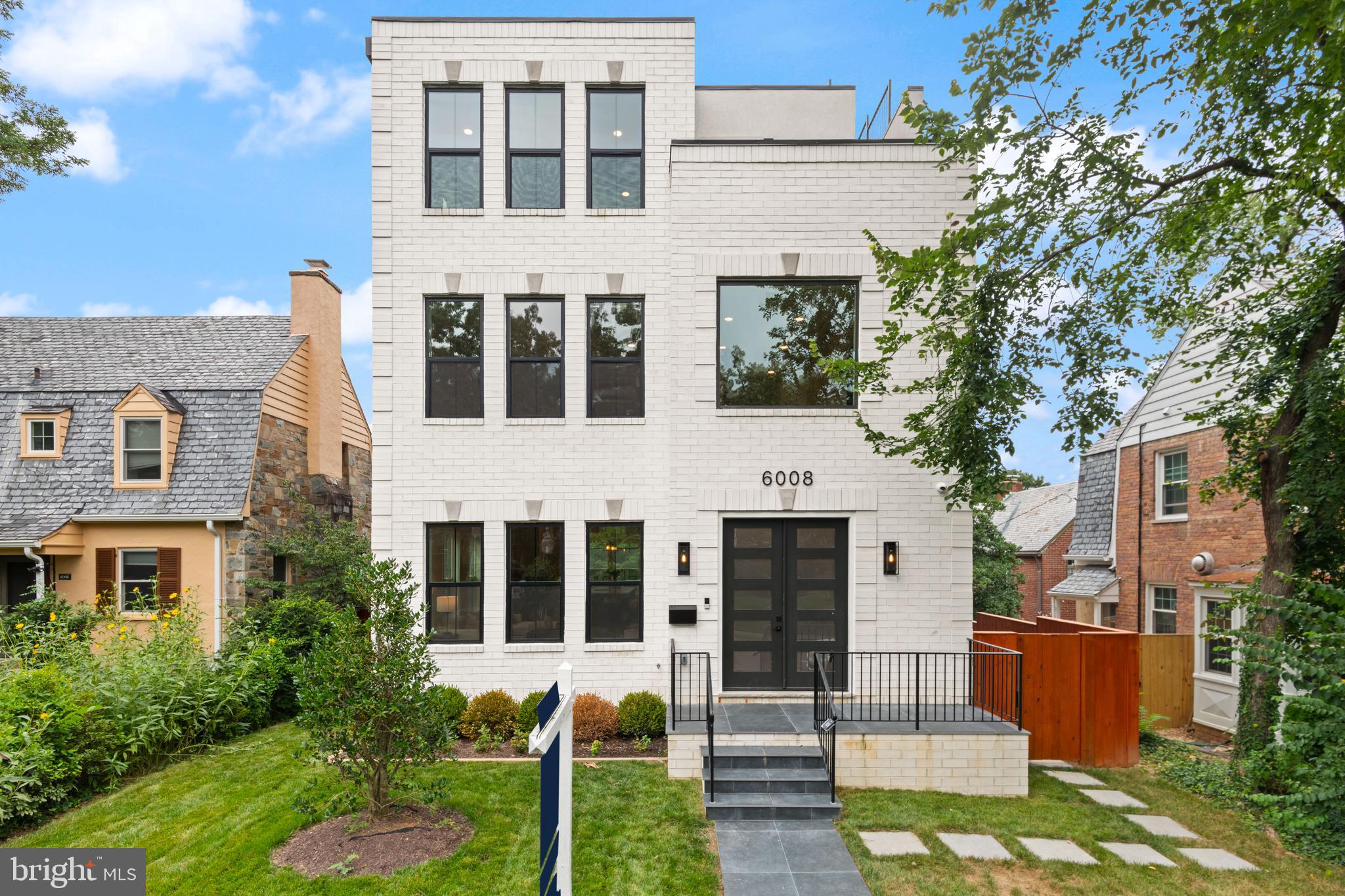 Welcome to 6008 34th Pl NW, an exceptional new home offering luxury, versatility, and a prime location in the sought-after Lafayette Park neighborhood. This spacious residence boasts seven full bedrooms and seven full bathrooms, including a separate one-bedroom, one-bath ADU unit above the garage with its own kitchen, washer, and dryer—making it ideal for guests, staff, or additional income. With stunning red oak hardwood floors throughout and modern finishes, the home is designed for upscale city living. An elevator provides effortless access to all four levels, and the rooftop deck above the primary suite offers panoramic views and outdoor entertaining options.

The first level features a culinary masterpiece kitchen with high-end finishes such as German-imported Leicht cabinets, quartz countertops, and premium Thermador appliances. Designed by Elite Kitchens, this open-concept space features soaring ceilings and seamlessly connects to the main living areas. A half bath adds convenience for residents and guests. On the second level, each bedroom is complete with its own en-suite bathroom, ensuring privacy and comfort, while a dedicated laundry room enhances practicality.

The top floor is dedicated to the luxurious primary suite, which serves as a tranquil retreat. It includes a private deck, two spacious walk-in closets, and a spa-inspired bathroom with a soak-in tub. A sleek wet bar completes this peaceful sanctuary. Outdoor living is equally impressive with a rooftop deck perfect for gatherings or relaxing escapes, as well as a private deck off the primary suite. The backyard offers open space, enclosed by a fence, with easy access to the garage parking below—providing ample outdoor space for outdoor activities and entertaining.

The finished basement features two bedrooms and two bathrooms, along with a large family room equipped with a wet bar, making it ideal for entertainment and relaxation. Parking is convenient with two interior spaces located below the ADU, providing ample room for residents and guests alike.

Located near Lafayette Park, residents enjoy access to Lafayette-Point-Park’s fenced playground, splash pad, basketball courts, shaded areas, and hiking trails of Rock Creek Park. Top-rated schools within walking distance include Lafayette Elementary, Deal Middle School, and Jackson-Reed High School. The vibrant neighborhood also offers nearby Chevy Chase shopping along Connecticut Avenue, featuring a variety of dining, retail, and entertainment options. 

Experience sophisticated city living with outdoor recreation and vibrant amenities at 6008 34th Pl NW—your ideal home in Lafayette Park.