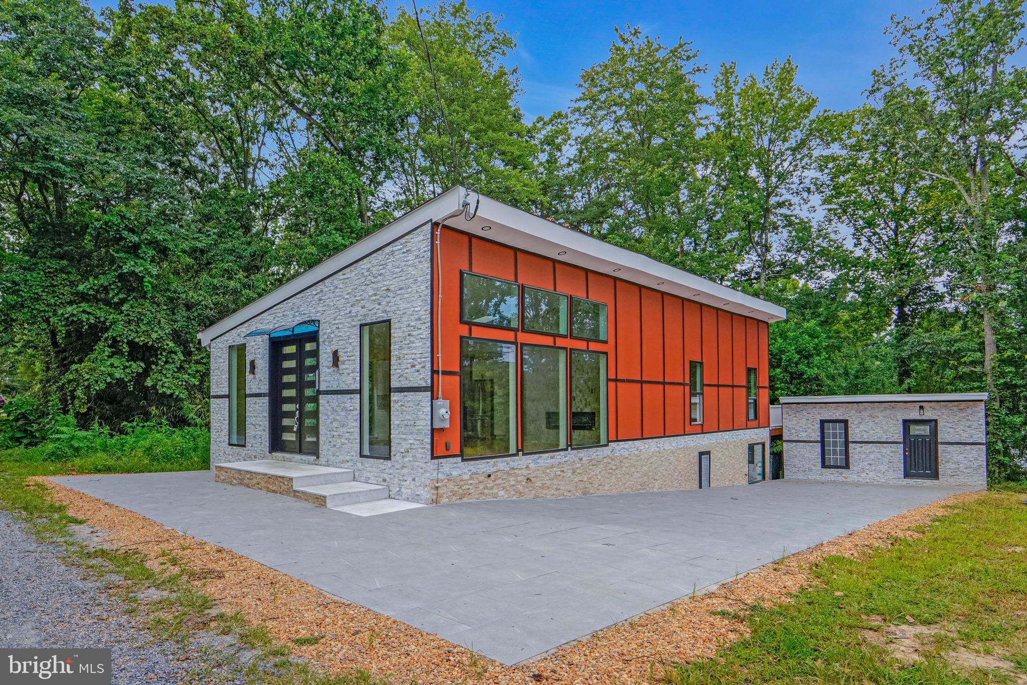 2,535 SQFT Modern Hilltop Home on 1.98 Acres | No HOA | Multi-Income Potential ✨ This is more than a home — it’s an investment opportunity with lifestyle perks. Located just 25 minutes from the White House and 12 minutes from National Harbor, this hilltop property offers stunning air quality, privacy, and city proximity all in one. Key Highlights: 2,535 SQFT of bright, modern living space with skylights and abundant recessed lighting 1.98 acres of prime land with no HOA — build up to 4 additional homes Safe, serene environment with expansive hilltop views and fresh, clear oxygen Multiple income streams: rent the basement, the office space, or lease the land for RV parking Luxury Interior Features: Brazilian cherry hardwood floors throughout Double kitchens with stainless steel hood and commercial-grade exhaust systems Marble tile fireplace surround & elegant marble tile accents Modern steel main and back doors for style and security Spacious walk-in closets Central A/C and ceiling fans with lights in multiple rooms Outdoor & Exterior Upgrades: 400 SQFT colorful composite deck for entertaining Hardy board siding for durability and modern curb appeal Elevated hilltop location for unobstructed views and better air quality Extra Bonuses: Separate entrances for privacy or rental flexibility Cozy yet modern design — ideal for both living and renting Plenty of space for RVs, gardens, or future builds 📍 Unbeatable Location: Just minutes to major attractions, dining, shopping, and commuter routes. Whether you want a primary residence with rental income, an investment property with expansion potential, or a multi-generational home, this property delivers. 📅 Schedule your private showing today and experience this unique hilltop gem for yourself.