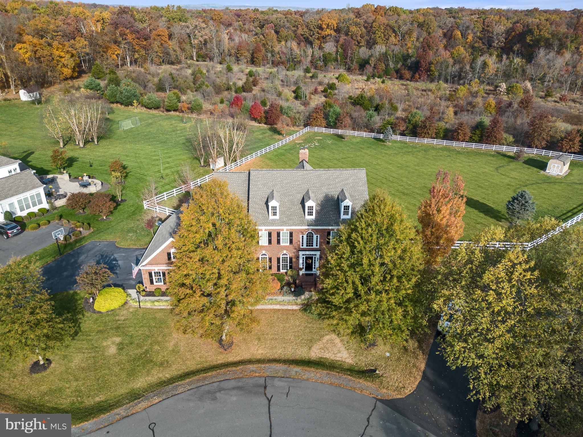 Sought-after Red Cedar Estate lot with rare 1.4 acres backing to 62 acre Conservancy Lot.  Over 6,000 sq ft, 3 car side-load garage, cul-de-sac.  Wide-plank newly refinished hardwoods on main (new hardwoods in family room). Gourmet kitchen with GE Monogram appliances, granite, oversized island, and butler's pantry.  Light-filled sunroom currently used as breakfast room.  Mudroom/laundry with separate entrance.  Family room off the kitchen with gas fireplace.   Main-level study with built-ins, bay window.  Primary bedroom with tray ceiling,  sitting room with gas fireplace and built-ins.    Finished walkout lower level, bedroom and full bath, laundry area.  Spacious recreation room with gas fireplace.  Newly fenced backyard with ample room for a pool.  Red Cedar was designed with Conservancy spaces which lends to a park-like neighborhood; boasts walking trails, outdoor pool, butterfly park, playgrounds and a vibrant active community. Close proximity to the Dulles Toll, Brambleton. Desirable Loudoun County HS, Simpson Middle. Sycolin Creek Elementary is located with access to the neighborhood for walking to school along with Loudoun Country Day School.
