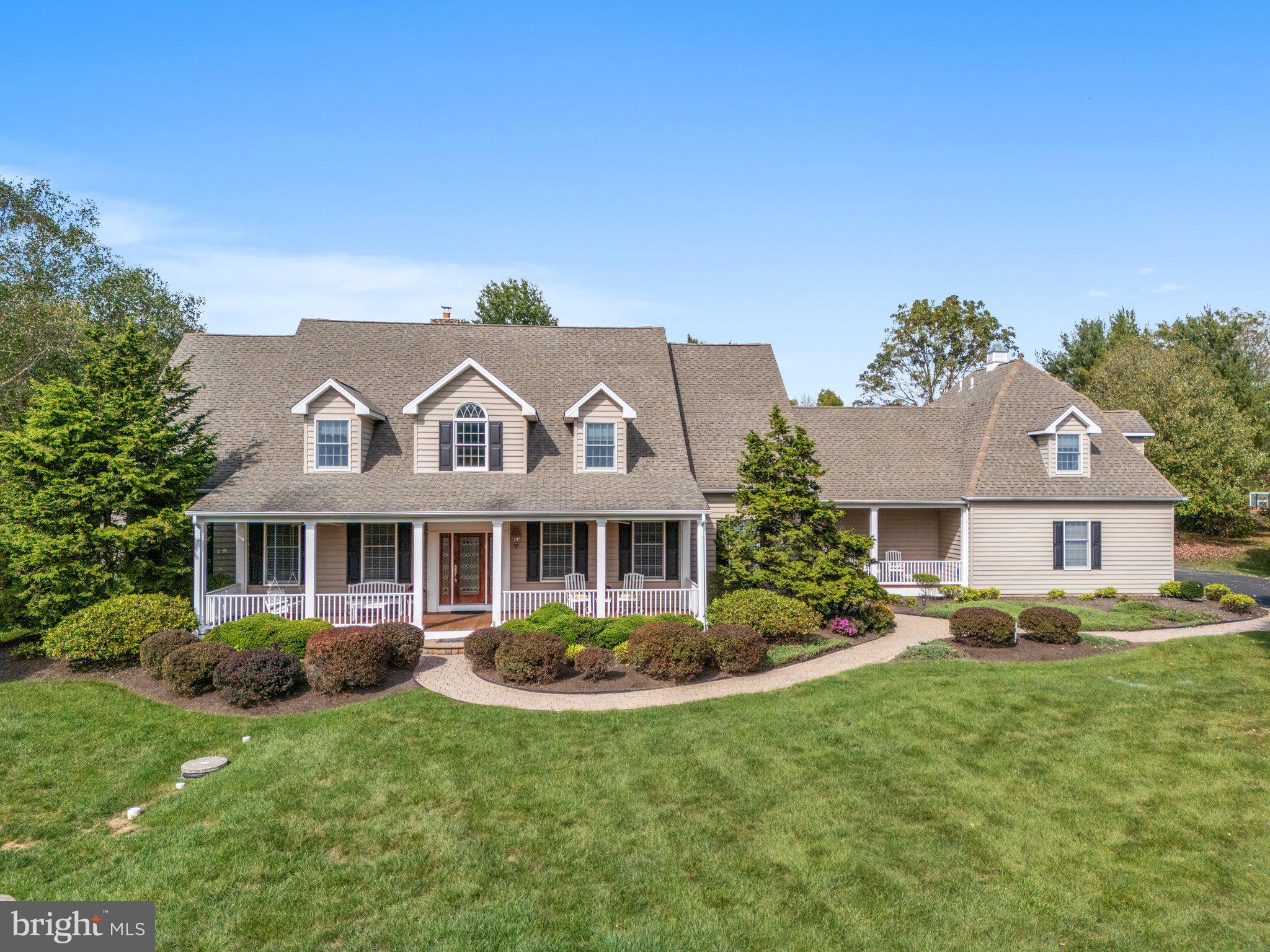 Welcome Home!  To this attractive custom home which is a design of nationally known architect, William Poole. This beautiful home offers superior craftmanship and a long distance picturesque view, this lovely home enjoys a prized setting among lofty trees and flowering shrubs within a charming cul-de-sac neighborhood in Buckingham township. Expanded and enhanced this home showcases numerous amenities and rich appointments. Architectural interests include the hipped roof, numerous windows, gable dormers, and charming covered porches. The heart of this home is the open gourmet kitchen which boasts granite countertops, dual serving islands, stainless steel appliances and rich cherry cabinetry. Serving as a perfect venue for entertaining is the Great room and step-down vaulted Sunroom, warmed by the dramatic floor to ceiling stacked stone fireplace these rooms highlight custom built-ins and a bridge overview. The spacious formal Dining room finishes off this entertaining area. Additional keynotes include; A Wall of windows with atrium doors which open to the paver patios, stone walls, a private putting green and an in-ground swimming pool. Joining the spaces are two first floor office with built in storage and shelving.  Five bedrooms, each with private baths, perfect comfortable accommodations as well as exquisite finishes. A large first floor Owners’ suite makes for easy relaxing at any time. The owner’s private bath with a whirlpool tub, dual vanities, closets, and oversized shower offers total functional luxury.  A versatile second floor guest retreat opens to a comfortable lounge  and can be easily accessed by the back staircase. Four additional incredible bedrooms and a loft which completes this upper level.  A tremendous finished basement is an entertainers dream with beautiful built-in bar, kitchen and full bath. This home has hardwood flooring, recessed lighting, abundant storage options and deep window sills throughout. Five zoned heating and cooling provides ultimate comfort. This prestigious property and stunning home blends to true elegance making it a treasure. This property is just off the beaten path very close to Doylestown, Lahaska and New Hope. This exceptional property is in the award winning Central Bucks School District. This is a must see! Schedule your private tour today.