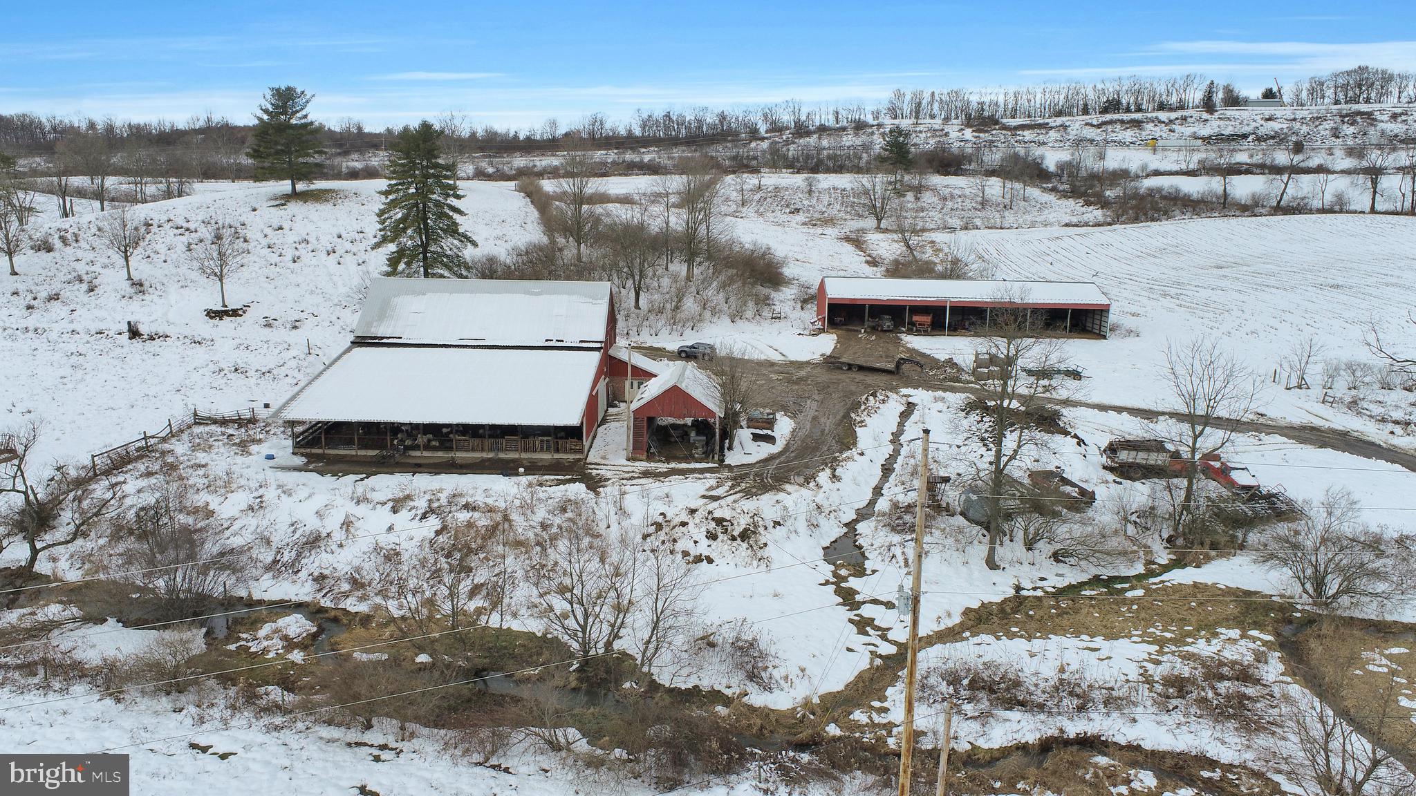 80 +/- acre farm with approx. 35 acres tillable, 10 acres wooded and the balance pasture. There is a 40' x 70' bank barn with a 40' x 70' addition and milkhouse added in 2005. The barn has a concrete feed alley with slant bars and can hold 50-55 steers comfortably. Additional outbuildings include a 40' x 120' pole barn and a 15' x 30' shed w/ corncrib. In addition to the 20 gpm drilled well, the spring fed stream, a tributary to Oppenheimer Run, flows through the pasture and could provide irrigation needs if desired. This farm would lend itself to various endeavors such as produce, poultry, small dairy  or recreation. There is no residence on this property, so you can build the house to your own liking. Even though it's bordered by, and has easy access to the I-99, the property has a rural and tranquil setting. Schedule your personal showing today to see the possibilities!
