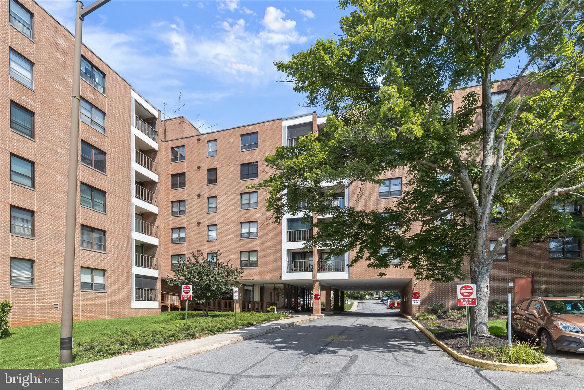 Welcome to this two bedroom, two bathroom fifth-floor condo in The Elmont. Awaiting your personal touches, this unit offers great potential to make it your own. A spacious open-concept living and dining area provides plenty of room for everyday living and entertaining, with sliding glass doors leading to a screened balcony. The kitchen includes a breakfast bar, ample cabinetry, and a pantry for added storage. The primary bedroom features a walk-in closet and a private bathroom with a walk-in shower. A second bedroom and full bathroom are located down the hall. Additional highlights include in-unit laundry, multiple closets including a large walk-in hall closet, a doorman in the lobby, elevators, and ample unassigned parking. Excellent location near Pikesville and Mt. Washington, just minutes from the Reisterstown Plaza Metro SubwayLink Station, I-695, I-83, and I-795.