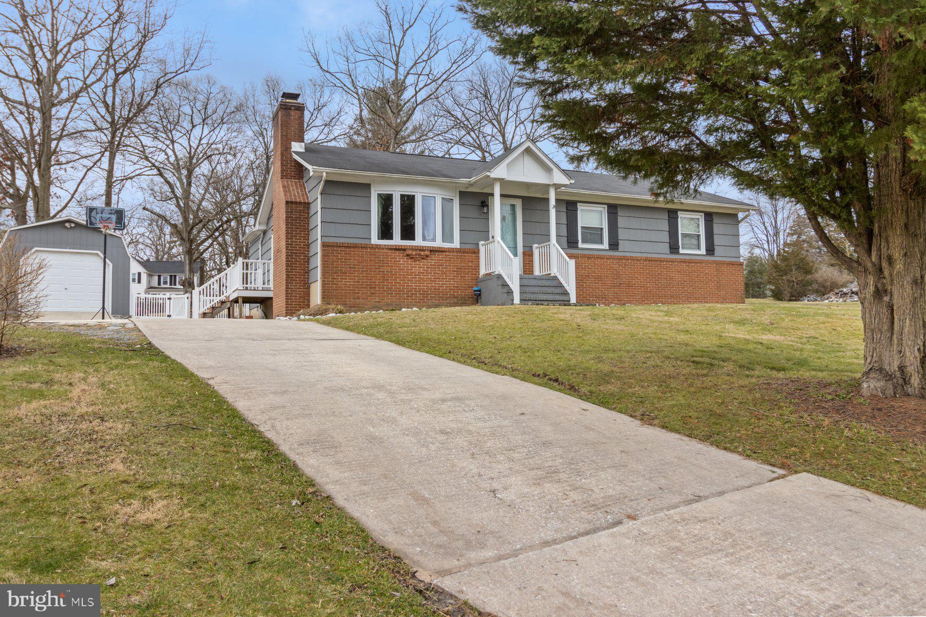 OPEN HOUSE CANCELLED. This is the one!! Fantastic rambler in sought after Timberview neighborhood in Elkridge. This adorable rambler is full of character and charm! Enter into an inviting family room with wood burning fireplace. Open to a dining and mudroom area with large open kitchen featuring farmhouse sink, granite countertops and LVP throughout the main level. Stunning sunroom addition with beautiful views of the oasis of a backyard. Two secondary bedrooms with an updated full bathroom in the hallway. Primary bedroom with half bath en-suite. Fully finished lower level with walkout access. Large finished family room with second wood burning fireplace. Full bathroom in the basement plus large unfinished storage area with laundry. Detached one car garage for additional storage with large driveway. Private almost half acre backyard perfect for entertaining.