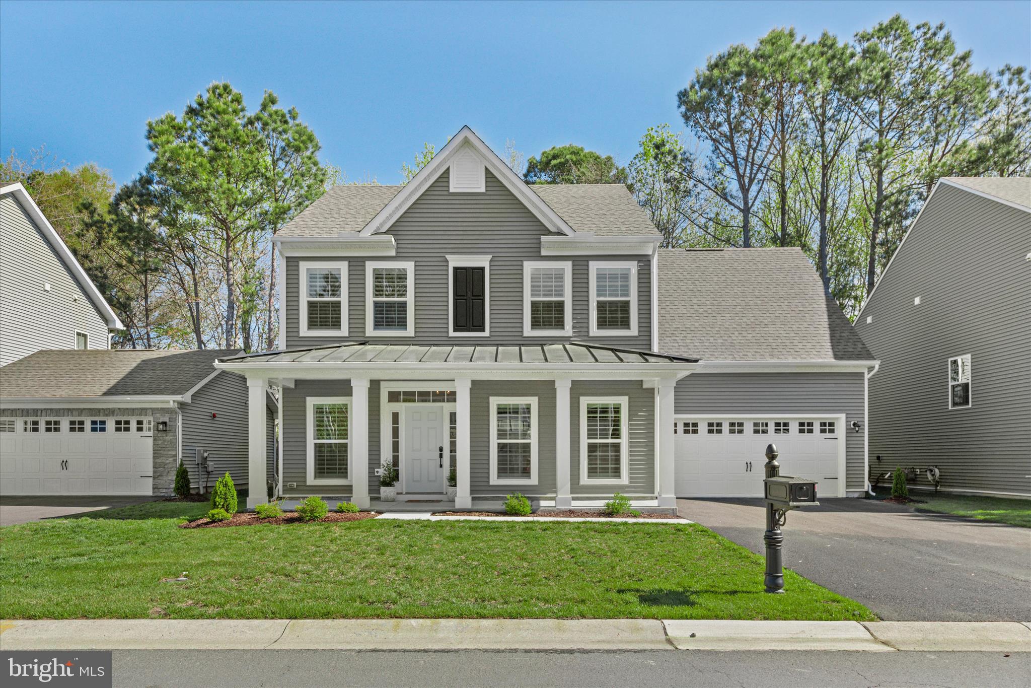 Welcome to 12105 Landings Boulevard—just one year young and beautifully maintained, this 4-bedroom, 2.5-bath coastal home feels brand new. Light wood-look luxury vinyl plank flooring flows throughout the main living areas, complemented by custom Hunter Douglas shades and professionally installed window treatments by Designing Windows.

A welcoming front porch sets the tone as guests arrive. Inside, the spacious foyer opens to a private study with French doors. To the left, you’ll find a convenient powder room, coat closet, and an oversized laundry room.

The foyer leads into the inviting great room and sun-filled morning/dining area, creating an open and airy layout ideal for both entertaining and everyday living. The great room flows seamlessly into the kitchen, offering a warm and functional space for gatherings or relaxed evenings at home. The kitchen features a large center island, ample cabinetry, and a pantry for additional storage.

Upstairs, three spacious guest bedrooms accompany a generous owner’s suite with a walk-in closet and luxurious bath featuring a soaking tub.

Outside, the backyard is already complete with sod, an irrigation system, and a wrought iron fence—making outdoor living easy from day one.

Located less than 5 miles from downtown Ocean City, close to historic Berlin, and just 6 miles from Assateague Island, this home offers the perfect blend of convenience and coastal lifestyle. Enjoy easy access to the beach, boardwalk, dining, and the natural beauty of the area. Community amenities are already complete and include a beautiful clubhouse with fitness center, indoor and outdoor pools, tennis courts, playground, nature trails, kayak launch, crabbing pier, and stunning bay views throughout the neighborhood. Golf carts are permitted, making it easy to enjoy everything this hidden gem has to offer.

Perfect as a full-time residence or coastal retreat, this barely lived-in home is ready for your personal touches—whether that means paint, wallpaper, or custom moldings. Just in time for summer and all the lifestyle this wonderful community has to offer.