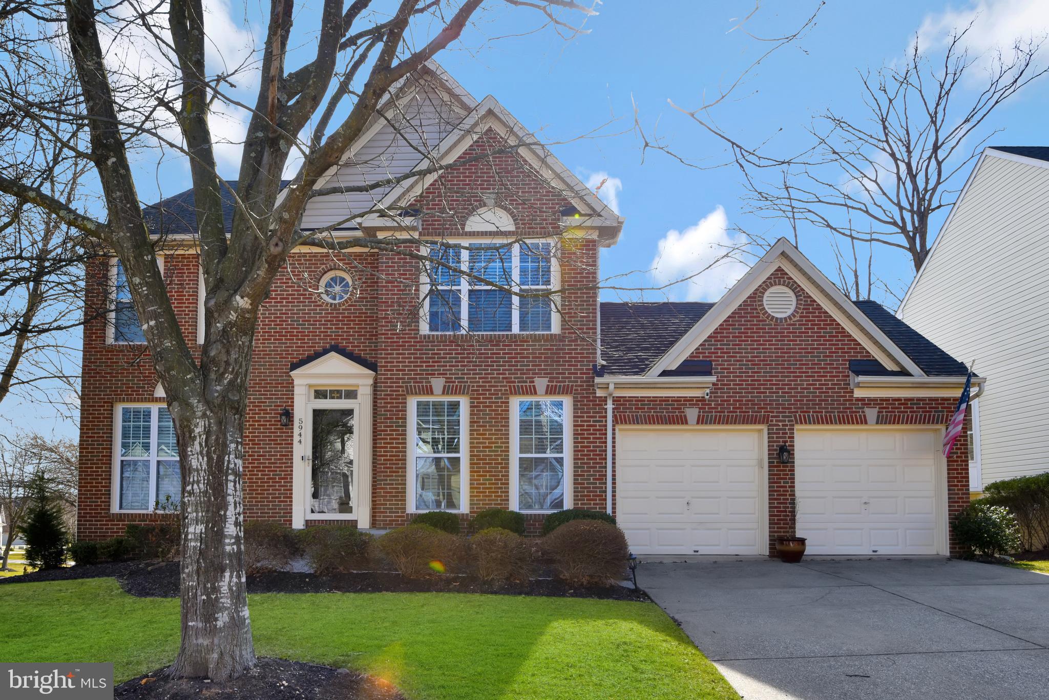Beautiful "John Adams" Built Colonial home with 4 bedrooms, 3 full and one half bathrooms in Lyndwood Manor.   This brick front corner lot home has great curb appeal, and more.  The main level features a separate living room, dining room, family room w/gas fireplace and kitchen and hardwood flooring throughout except the family room, which is carpeted.  The gourmet kitchen features stainless steel appliances with 4-door refrigerator/freezer with water and ice in the door, a smooth cooktop (cerran) stove with dual oven, a built-in microwave, dishwasher and deep sink with garbage disposal, granite counter tops and a ceramic tile backsplash plus there is an eat-in area.  The elegant dining room features chair rail, crown molding and wainscoting as does the Living Room.   The main level also has a deck off of the kitchen eat-in area that leads to the rear yard.  The upper level has 4 generously proportioned bedrooms and 2 tastefully updated full bathrooms (one in the primary bedroom). The primary bedroom has cathedral ceiling, it's own ensuite bathroom with separate tub and shower and a walk-in closet with built-in closet system.  The lower level is mostly finished including a large recreation room with walk-out level slider to a patio and the rear yard and there are blinds in the sliding door, there is a fully finished storage room (which could be used as a guest bedroom), a luandry/ utility room and another full bathroom .  The ceiling is composed of acoustic ceiling tiles for added sound insulation.  Come see this gorgeous home today!