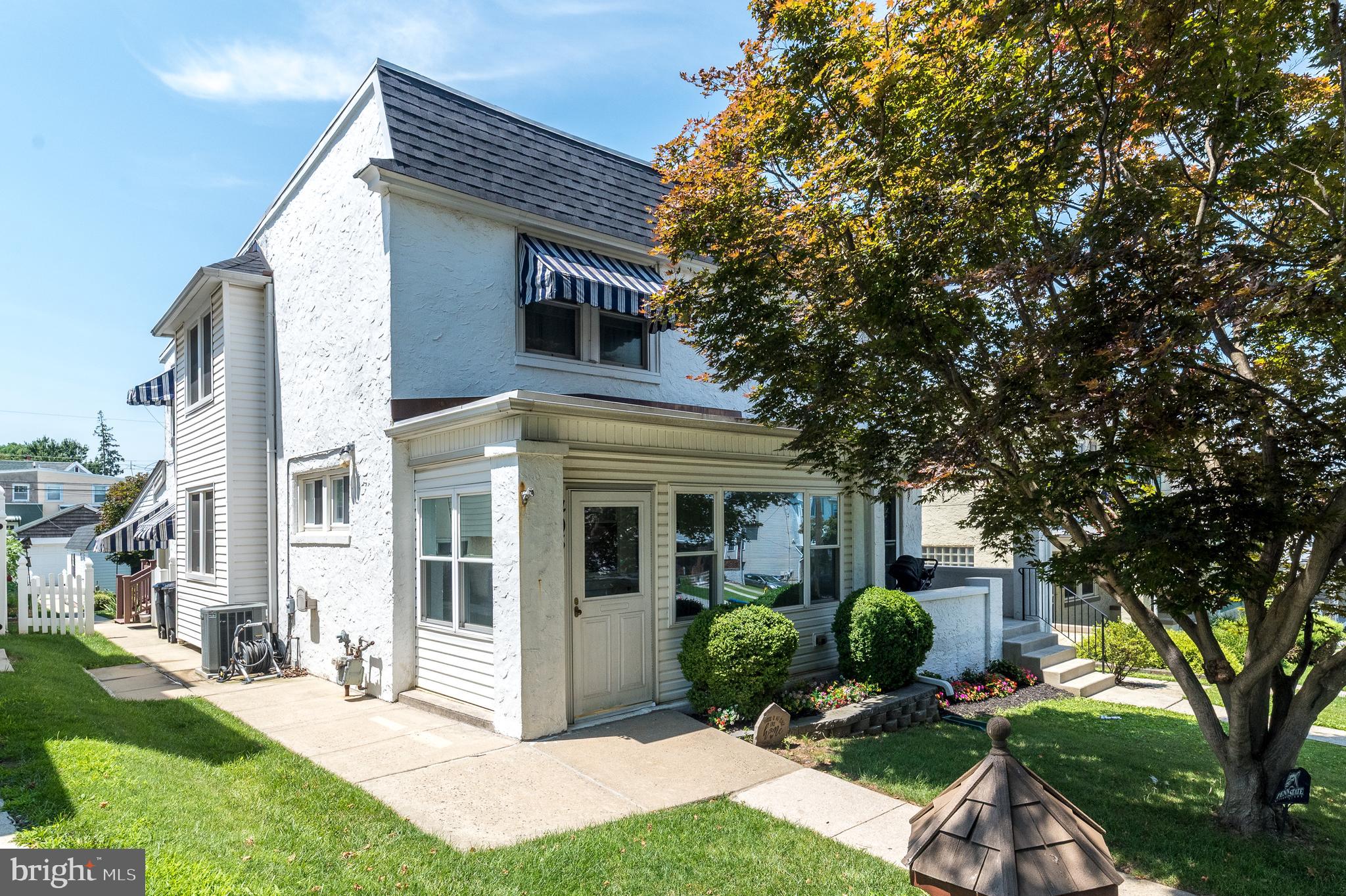 Welcome to 405 W. Eleventh Avenue, a charming 3-bedroom, 1.5-bath twin home nestled in the heart of Conshohocken Borough within the highly regarded Colonial School District. Offering the perfect blend of classic character and modern updates, this move-in-ready home features 1,256 square feet of comfortable living space, a detached garage, fenced backyard, and an unbeatable location just minutes from everything Conshohocken has to offer. From the moment you arrive, you'll appreciate the inviting enclosed front porch, complete with a built-in bench and storage closet, an ideal space to enjoy your morning coffee or unwind at the end of the day. Step inside to a welcoming living room that flows seamlessly into the formal dining room, with hardwood flooring waiting beneath the carpeting, ready to be uncovered and restored to its original beauty and natural chestnut woodwork that was painstakingly refinished. The beautifully remodeled kitchen serves as the heart of the home, showcasing quartz countertops, gas cooking, ample cabinetry, and a functional layout that makes meal preparation a pleasure.  Located just off the kitchen is a well sized mudroom entry which leads you out back to the deck or down to the full basement A conveniently added powder room completes the main level. Upstairs, the spacious primary bedroom offers exceptional storage with two deep custom closets, an additional linen closet, and a ceiling fan for year-round comfort. Two additional bedrooms feature generously sized closets and share the full hall bathroom with a tub/shower combination..  The basement is a bright area, currently used as a work area and sewing/craft zone and provides excellent storage space and endless potential for future finishing while already offering the peace of mind of a waterproofing system. Step outside to your private backyard retreat, where a large covered maintenance-free deck 20 by 18 feet, creates the perfect setting for outdoor dining, entertaining, or simply relaxing. The fully fenced yard offers plenty of space for pets, gardening, or play, while the detached 14-foot garage provides additional storage, workshop space, or protected parking. Major updates include a new roof (2021), replacement windows (2021), a new hot water heater (2025), central air conditioning, and a whole-house Generac generator, offering comfort and peace of mind for years to come. Ideally located within walking distance of Sutcliffe Park, featuring athletic fields, basketball courts, walking trails, and a playground and just a short drive to all that King of Prussia has to offer. This home is also just five minutes from the Pennsylvania Turnpike, I-476, IKEA, and the countless shops, restaurants, and nightlife that make Conshohocken one of Montgomery County's most desirable places to call home. Offering charm, thoughtful updates, outdoor living space, and an unbeatable location, 405 W. Eleventh Avenue is ready to welcome you home. Don't miss your opportunity to make this gem your own!