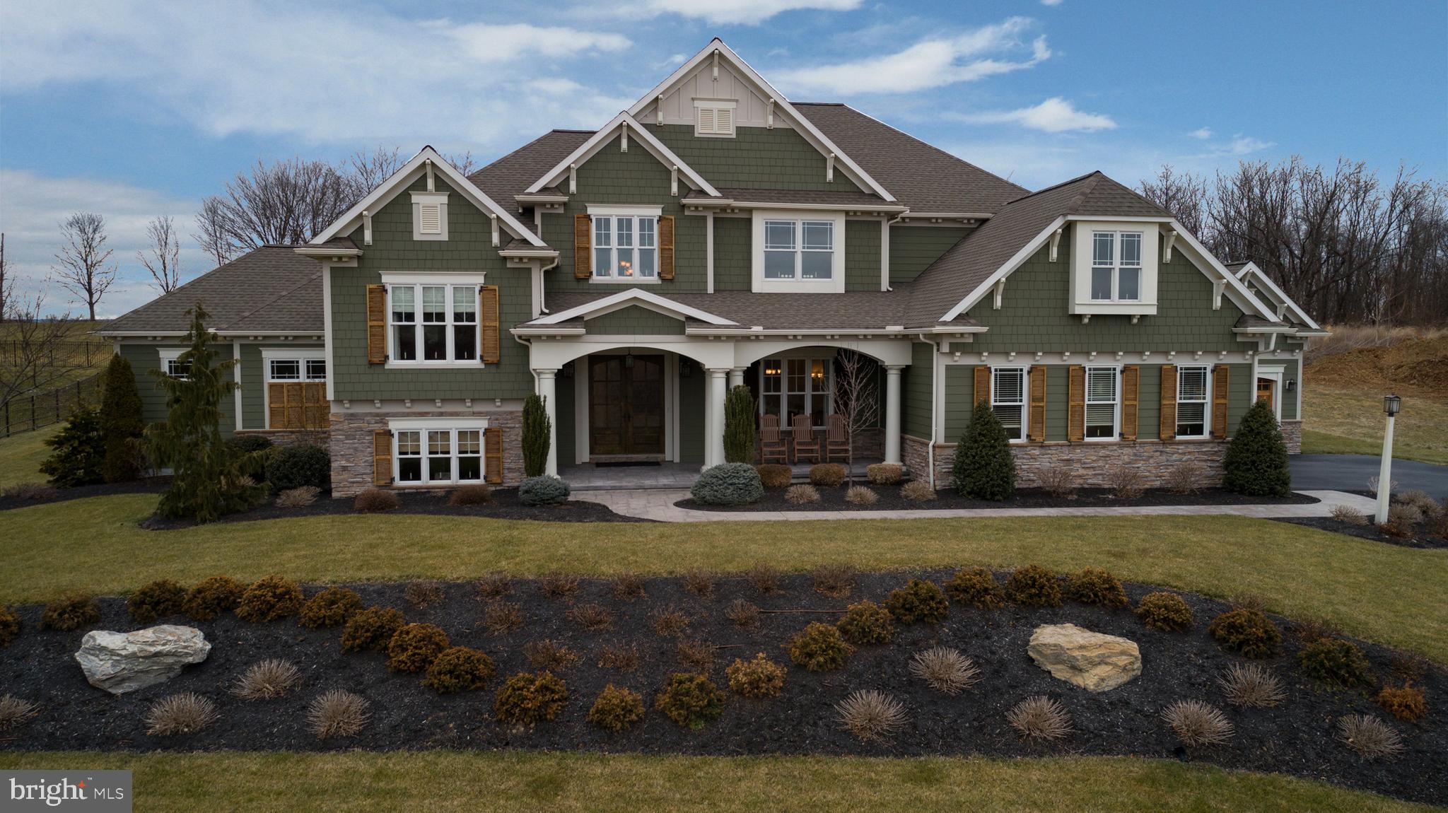 Don't miss this rare opportunity to make an exceptional property like this one your new home!  Upgrades and special architectural features abound here both inside and out.  Spacious foyer with a view of the two story great room with a beautiful FRPL, gleaming wood floors and coffered ceiling makes a great first impression as you enter.  Dream KIT with high end stainless steel appliances, Beiler custom cherry cabinets, granite counters, solid cherry wood snack bar, tile floors and walk-in pantry is open to a gathering/dining area for optimum function.  First floor MBR suite with tray ceiling, sitting room, two large walk-in closets and luxury bath w/whirlpool tub, large tile shower and two vanities with Cambria quartz countertops.  Lush office w/striking stone wall and coffered ceiling - an ideal private retreat space.  Second floor features two loft areas, three spacious bedrooms, each with a walk-in closet, and two full baths.  Beautifully finished lower level with exterior access features a second fully equipped kitchen, eatery area, rec/media/play area spaces, half bath and an exercise room.  Add to all of that an amazing outdoor living/playing /entertaining area including a sweet screened porch, 20x40 heated, salt water, inground pool w/three waterfalls & more.  Prepare and serve meals from a well equipped outdoor kitchen including a frig, Lynx grill & granite counters.  Hang out around the large gas firepit with family and friends.  Professionally landscaped, underground sprinkler system,  garage space for three cars w/cedar wood doors, Generac whole house generator,  energy efficient geo-thermal HVAC system, and so much more.  The list of special features goes on and on.   Delightful neighborhood in a super convenient location just minutes to Hershey Medical Center.  Words simply do not do it justice; you must see this amazing  property!!