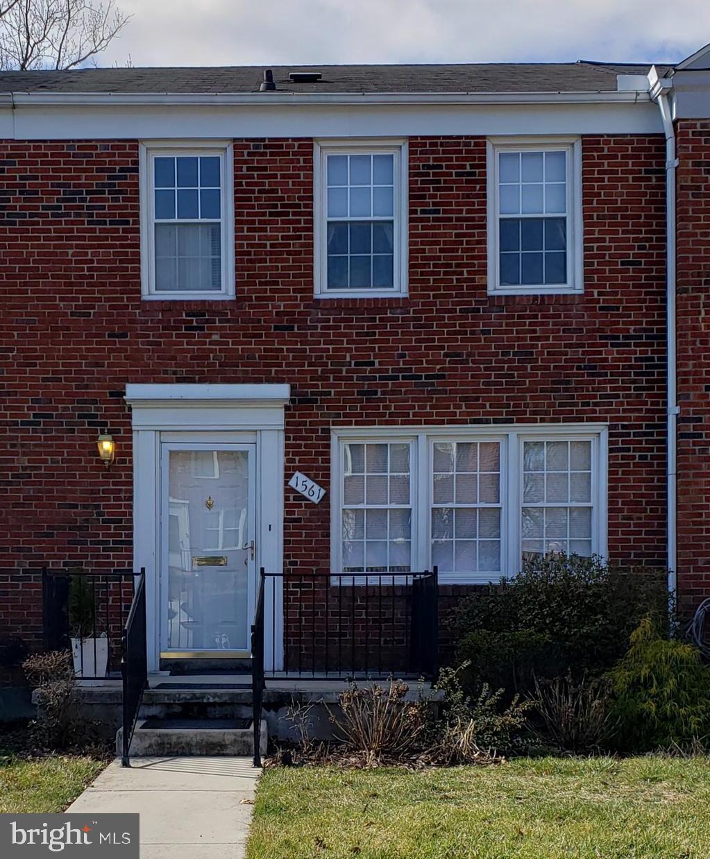 Listed and Sold Simultaneously.  Lovely interior Loch Raven Village rowhome ready for your personal touches.  Carpet has been removed to show the beautiful original hardwood floors.  Kitchen was updated with white cabinets, built-in microwave and corian countertops.  Relax on the wrought iron deck off the kitchen with a new retractable awning for some shade.  Three bedrooms on the upper level all have the original hardwood floors and ceiling fans in each room.  Full Bath on the upper level with a shower tub that was just reglazed.  The full basement with a 1/2 bath has the original knotty pine walls and a large bar for entertaining guests.  Parking on property in rear yard.